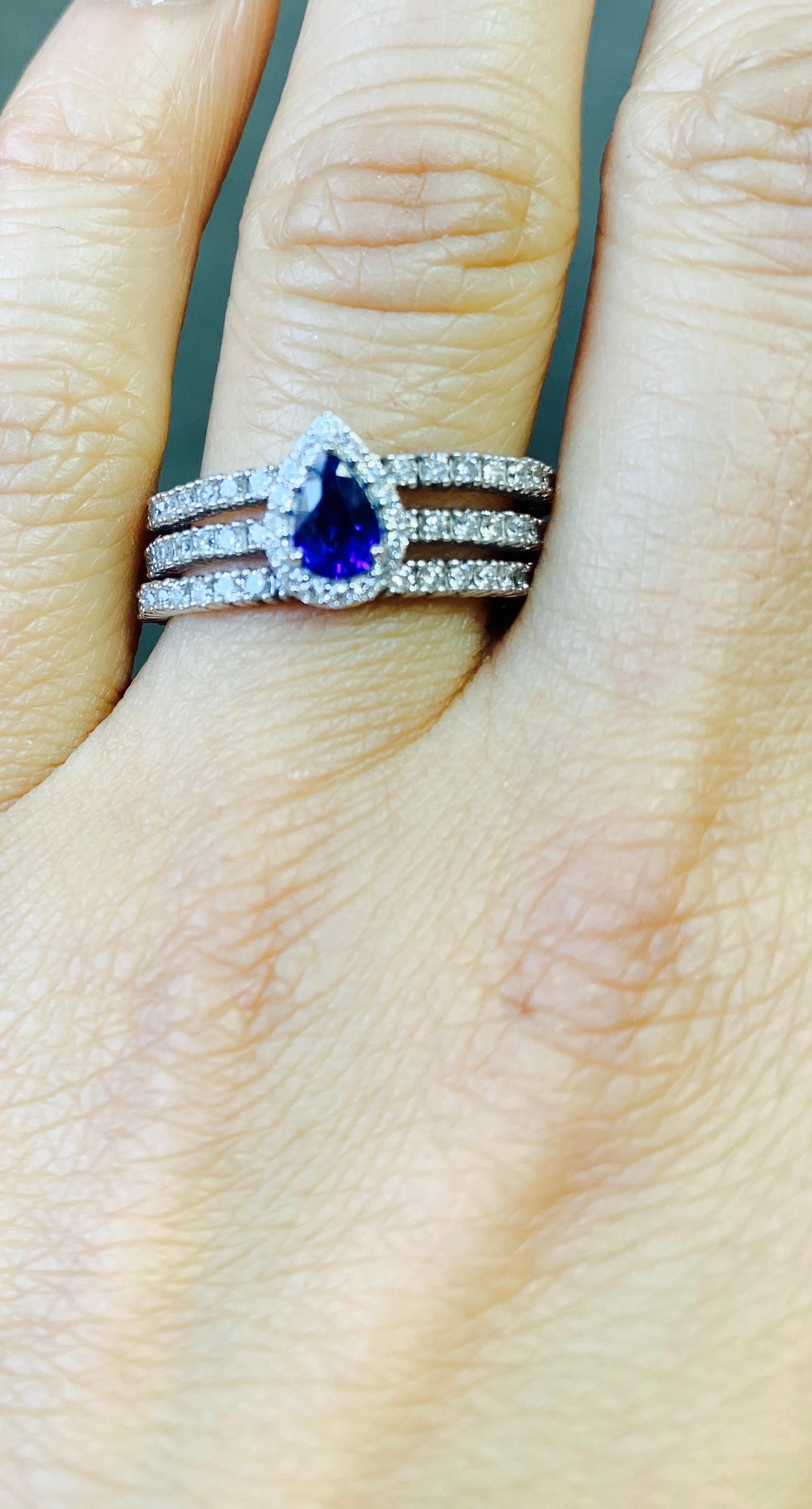 Pear Cut Blue Sapphire and Diamond Flexible Ring in 14 Karat White Gold. For Sale