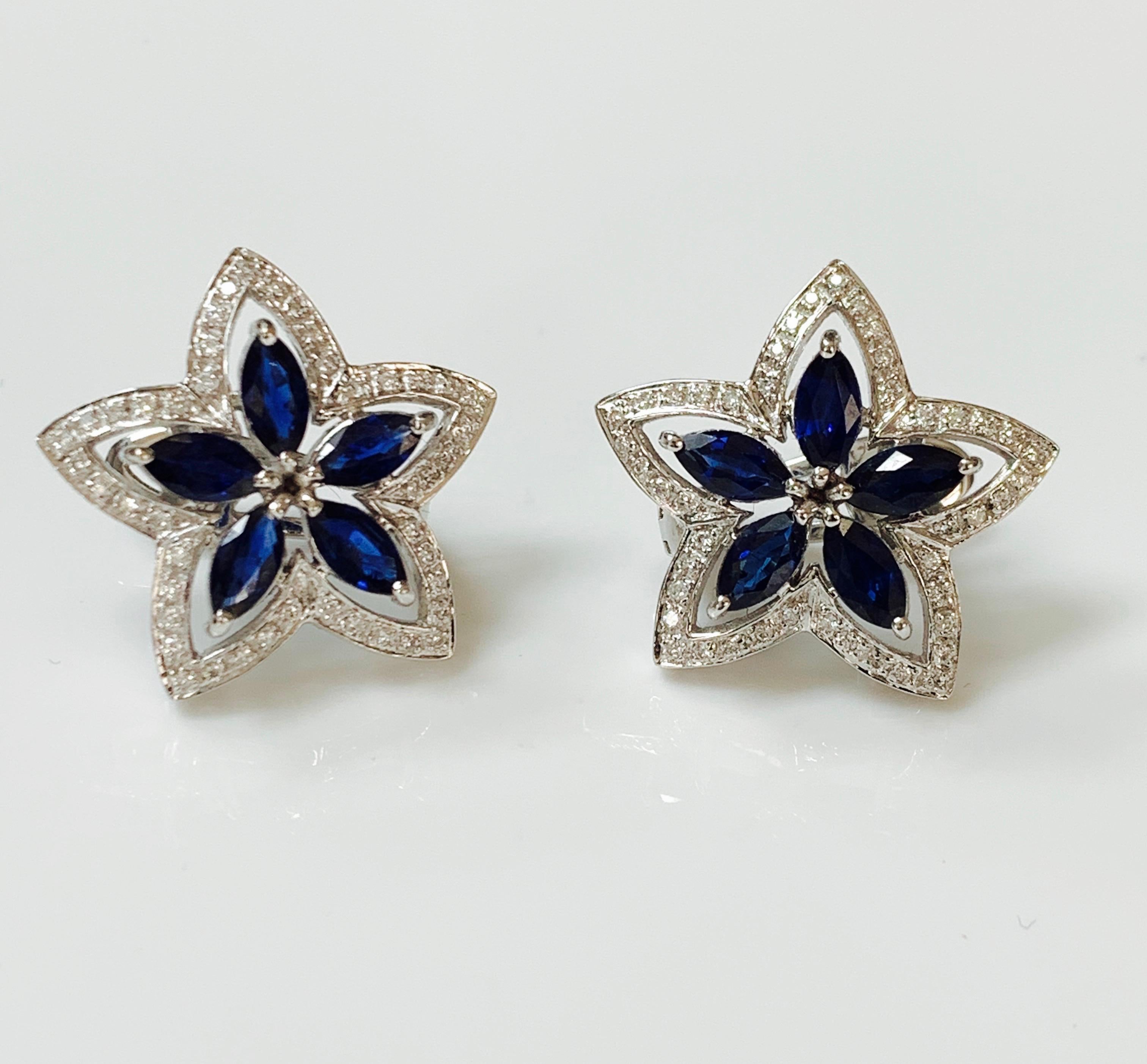 Gorgeous pair of diamond and blue sapphire star stud earrings hand crafted in 18 k white gold. 
The details are as follows : 
Diamond  weight : 0.50 carat 
Blue Sapphire weight : 2.82 carat 
Measurements : 1 inch by 1 inch 
