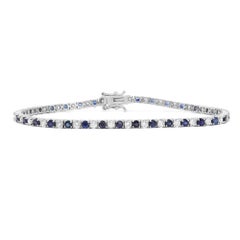 Bracciale tennis con zaffiri blu e diamanti in oro bianco 14K 3,40cttw