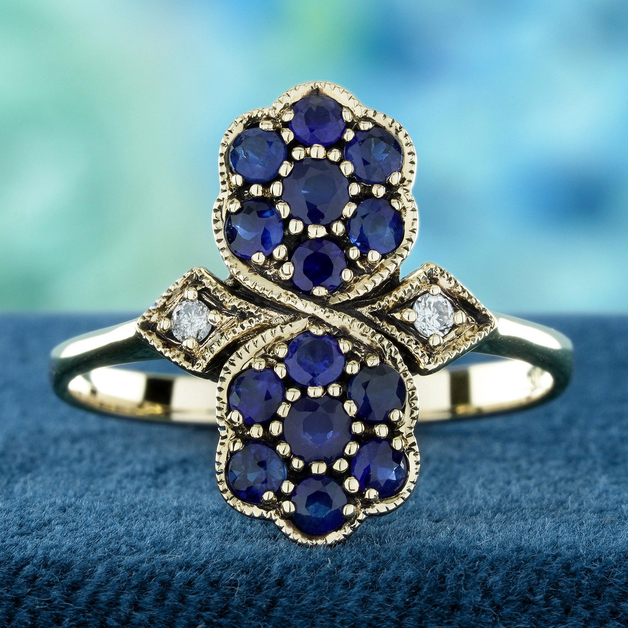 This vintage-style ring features two blooming floral motifs with prong-set natural blue sapphires. Each sapphire is richly colored, symbolizing elegance and depth.
Brilliant diamonds flank both sides, adding sparkle and refined contrast. Delicate