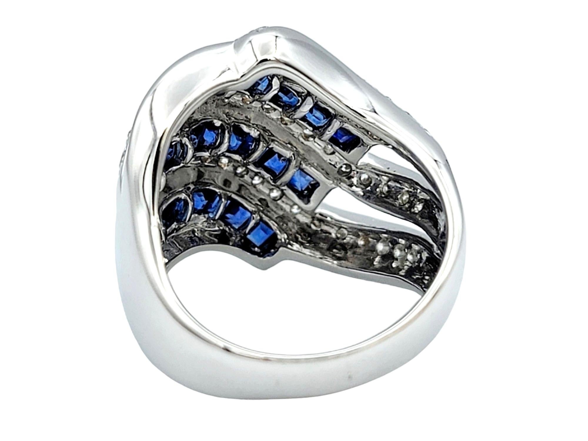 Women's Blue Sapphire and Diamond Wave Design Wide Band Ring Set in 18 Karat White Gold For Sale