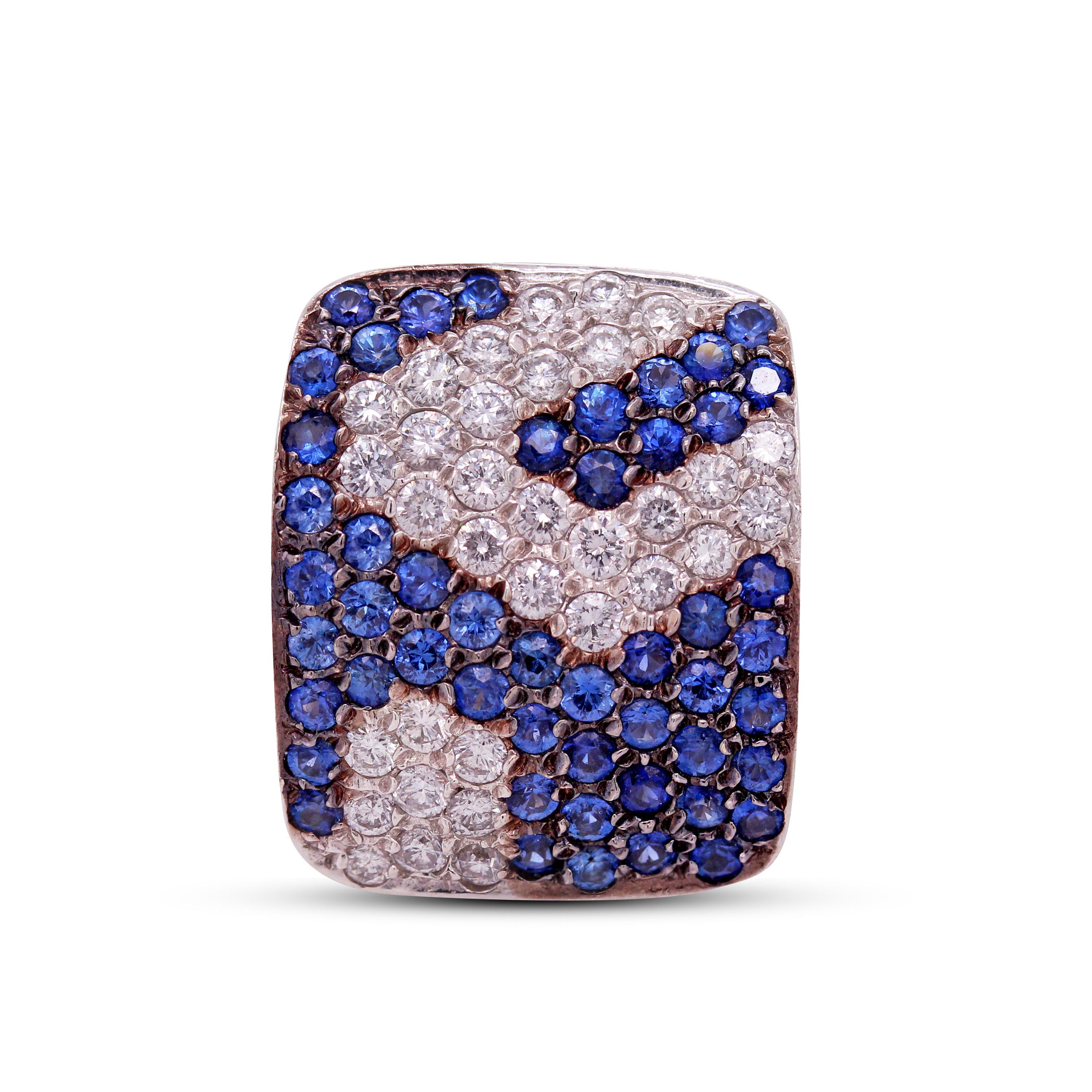 18K White Gold and Diamonds Blue Sapphires Square Face Cocktail Ring

Apprx. 2 carat Blue sapphires total weight
1 carat diamonds apprx. total weight

Ring face is 0.80 inch by 0.65 inch
Band is 6mm in width

Size 7. Sizable by request.