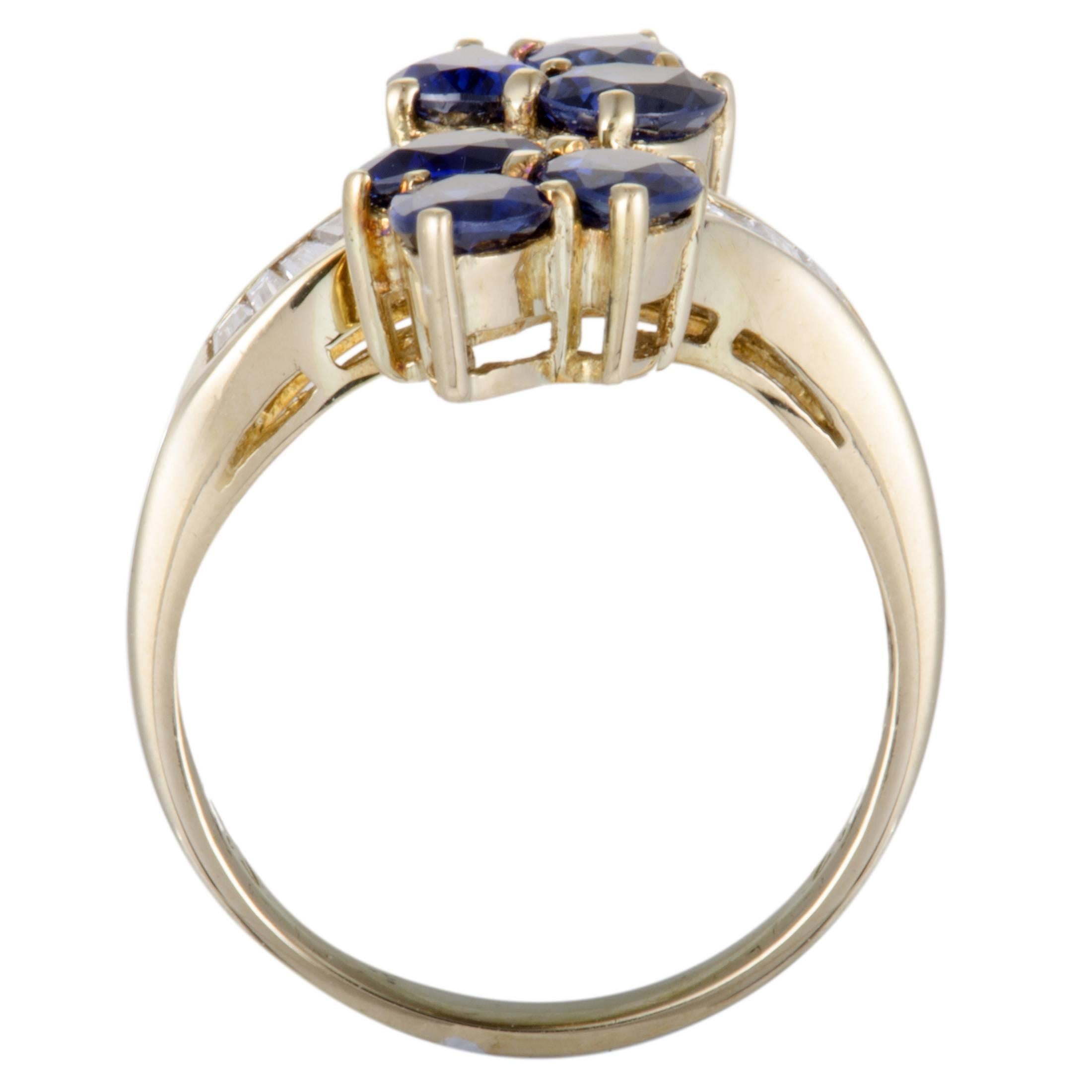 This exquisite ring is an attractive illustration of elegance! Gorgeously designed in shimmering 18K yellow gold, the stunning ring's design is embellished in 0.56ct of scintillating diamonds and 2.42ct of beautiful blue sapphires that enhance the