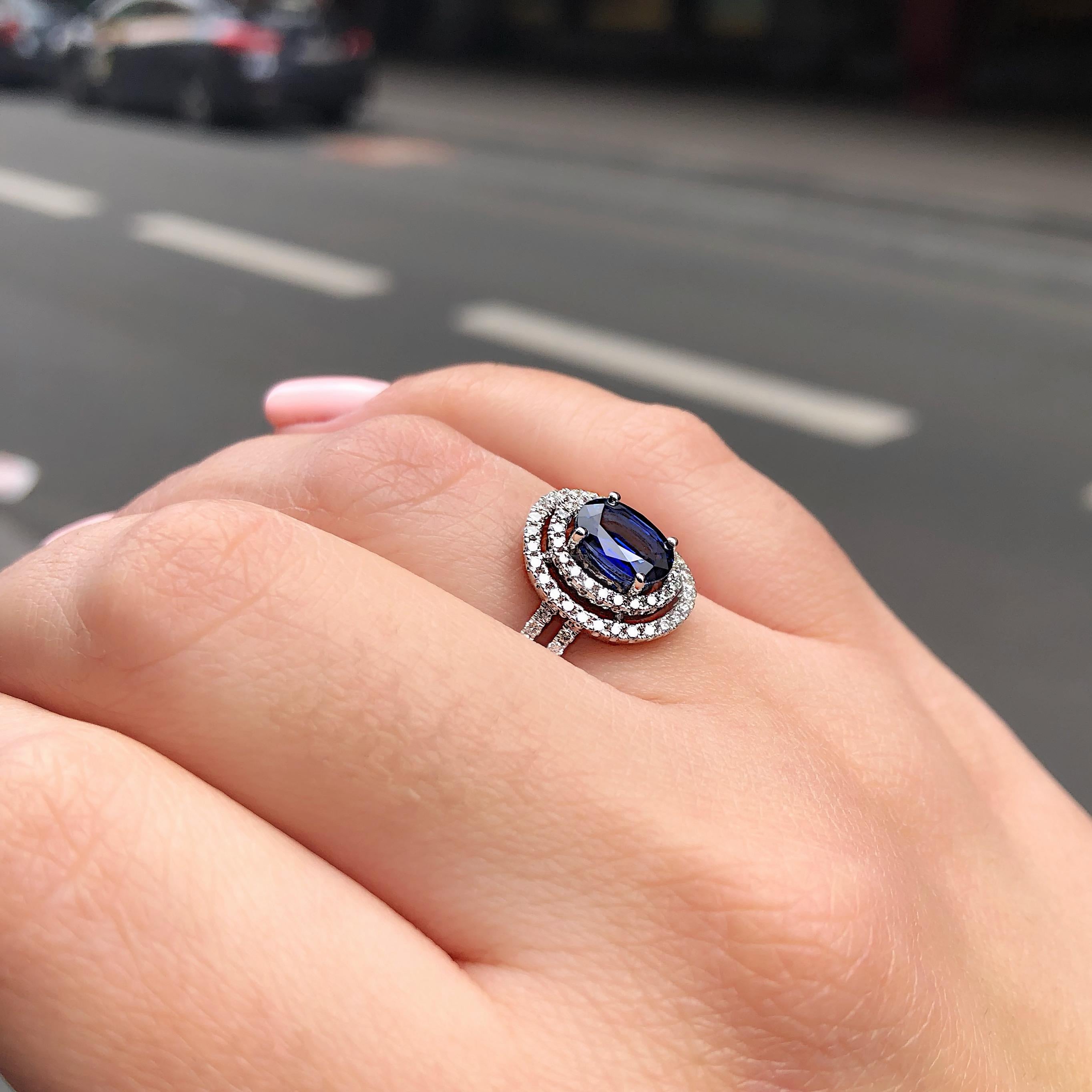 Women's Blue Sapphire and Diamonds Double Halo Engagement Ring in 18 Karat White Gold For Sale