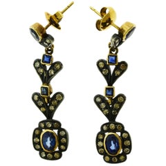 Blue Sapphire and Diamonds Set in 18 Karat Gold with Rodium Antique Earrings