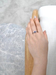 Blue Sapphire and Diamonds Twist Tension Engagement Ring in 18K White Gold