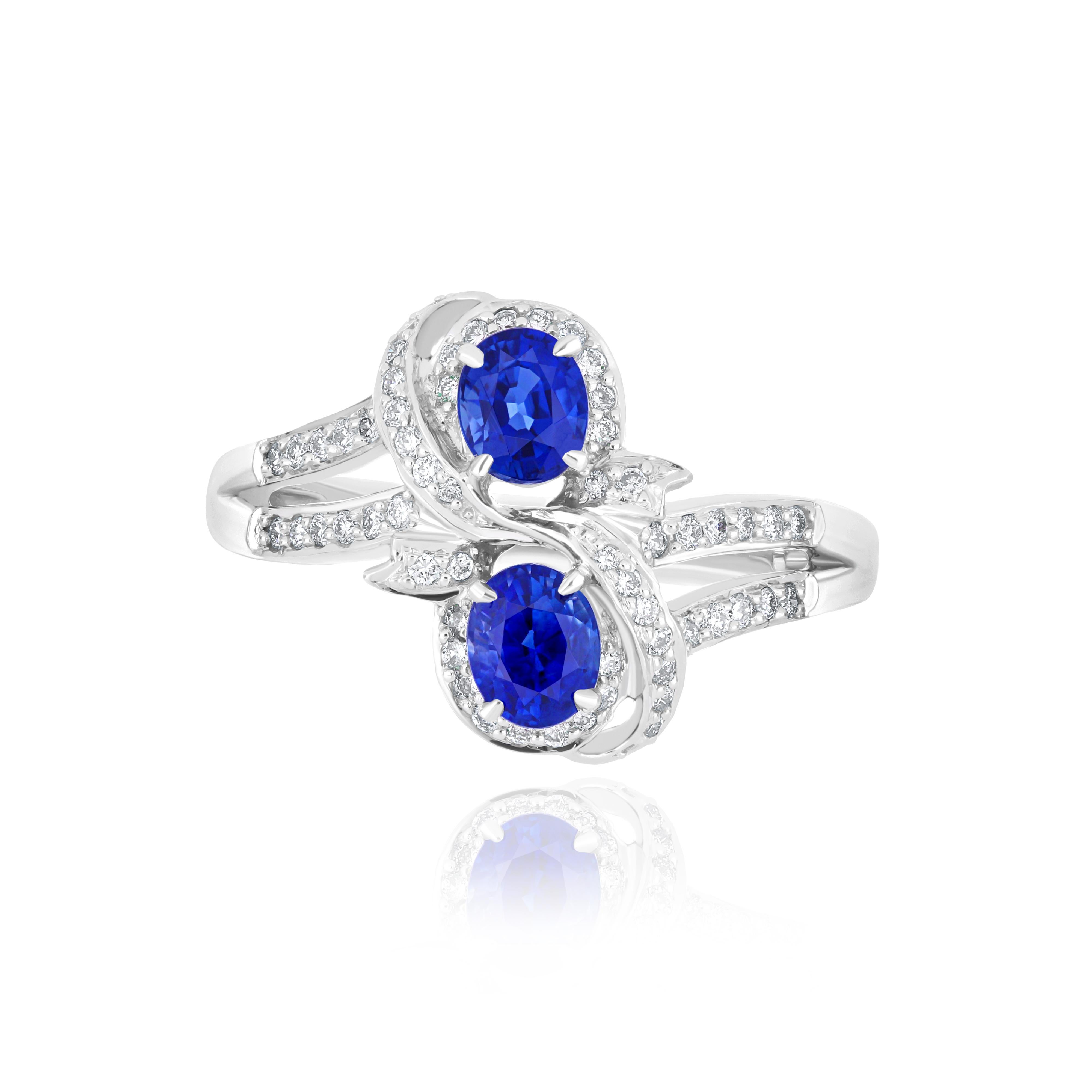 Elegant and exquisitely detailed 18 Karat White Gold Ring, center set with 1.14Cts .Oval Shape Blue Sapphire and micro pave set Diamonds, weighing approx. 0.27Cts Beautifully Hand crafted in 18 Karat White Gold.

Stone Detail:
Blue Sapphire: