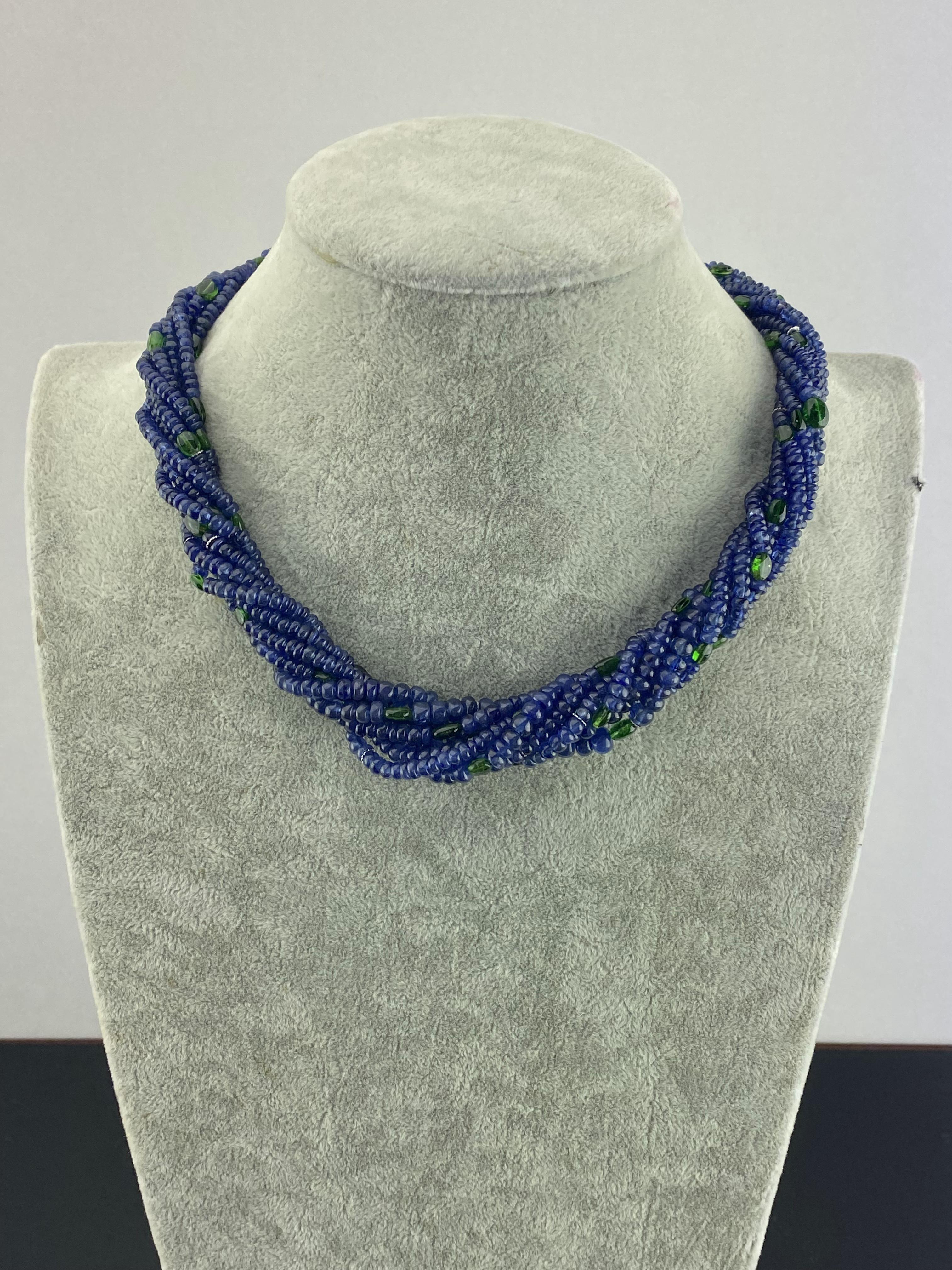 420 carat Blue Sapphire beads and 37 carat Emerald beads necklace, with a 14K White Gold clasp, studded with White Diamonds. The total length of the necklace is around 20 inches, and it can be customized/altered. 
We provide free shipping. We accept