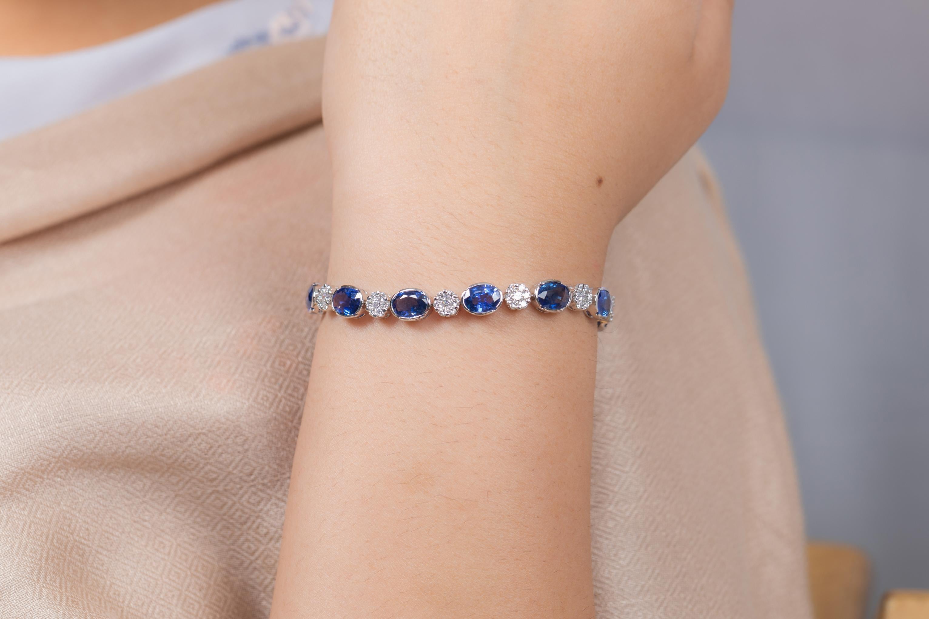 Oval Cut Blue Sapphire and Flower Diamond Tennis Bracelet in 18K White Gold For Sale