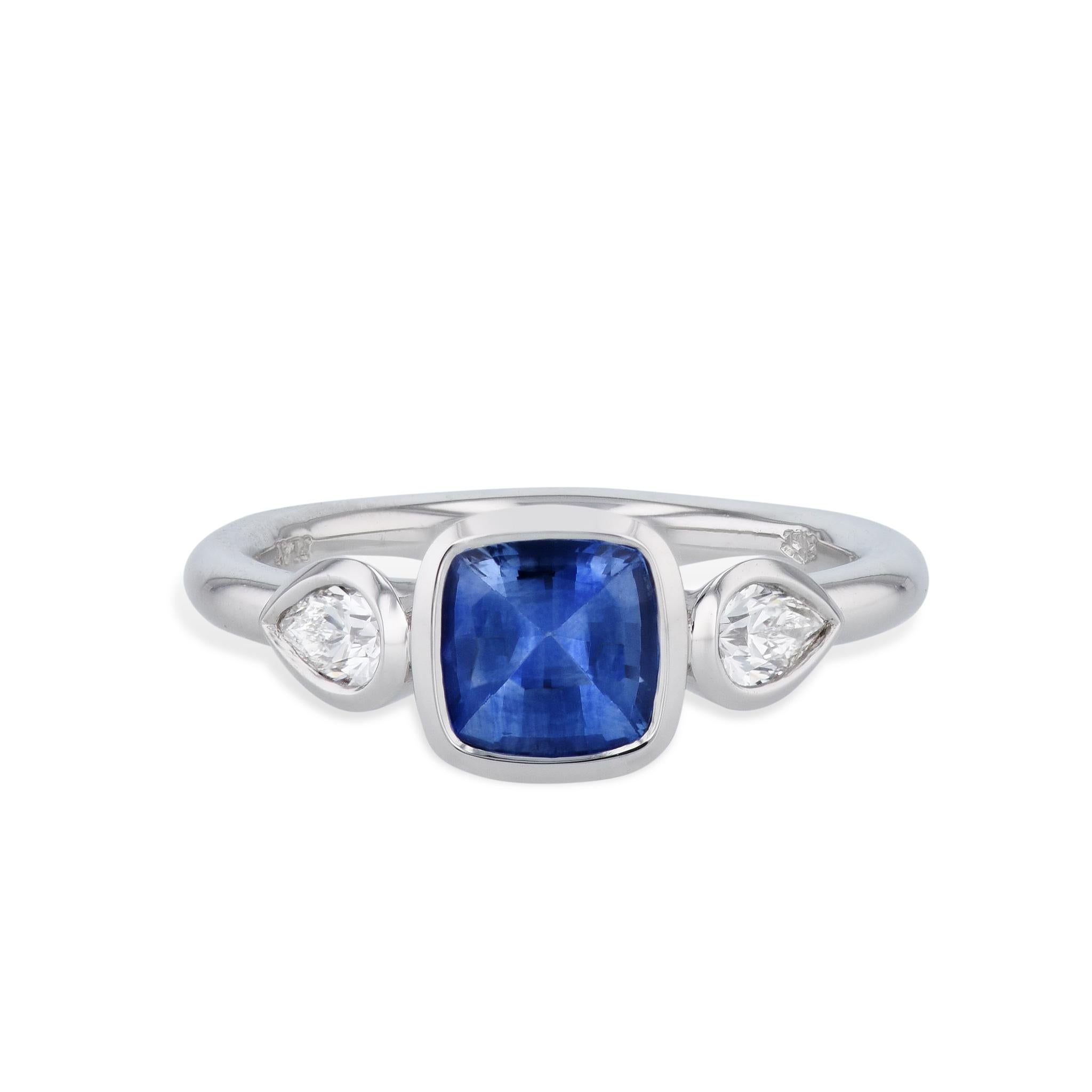 Modern Blue Sapphire and Pear Shaped Diamonds Platinum Ring For Sale