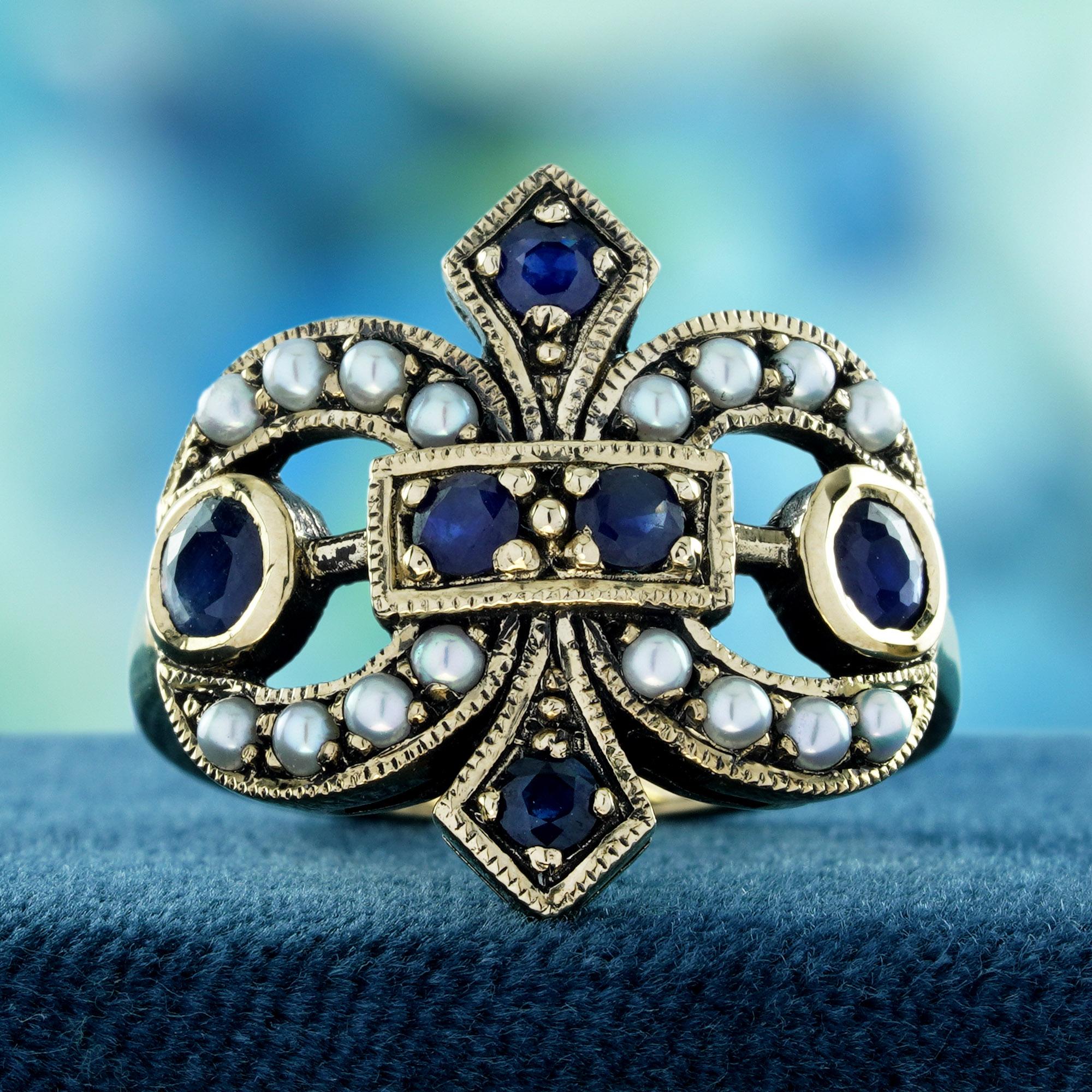 Scopri un'eleganza senza tempo con il nostro anello a grappolo con zaffiro naturale e perla in stile vintage, realizzato in oro giallo massiccio 9 carati. 
Questo squisito anello presenta un'accattivante composizione di ricchi zaffiri blu e perle