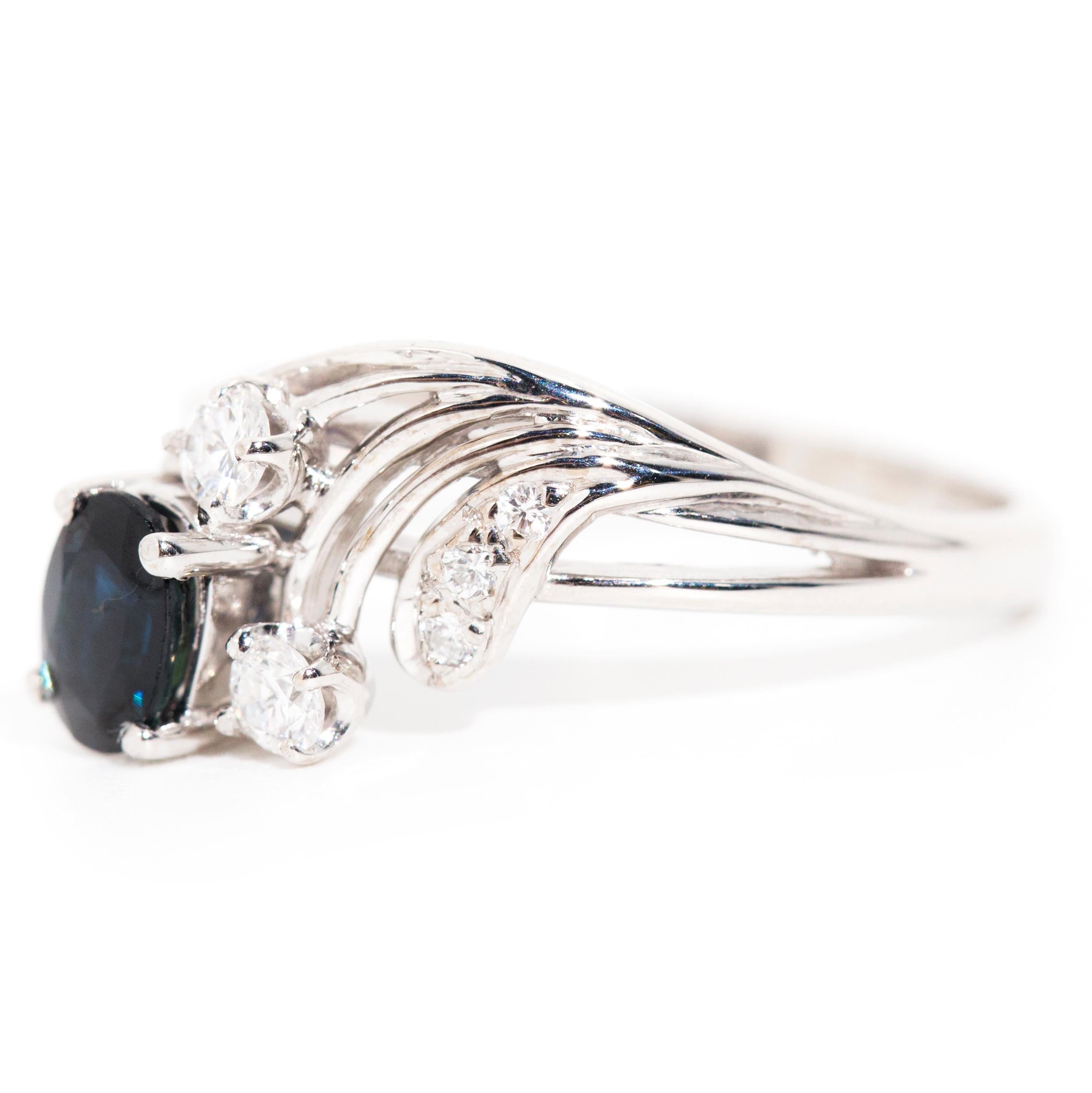 Oval Cut Blue Sapphire and Round Diamond Vintage Engagement Ring in 18 Carat White Gold