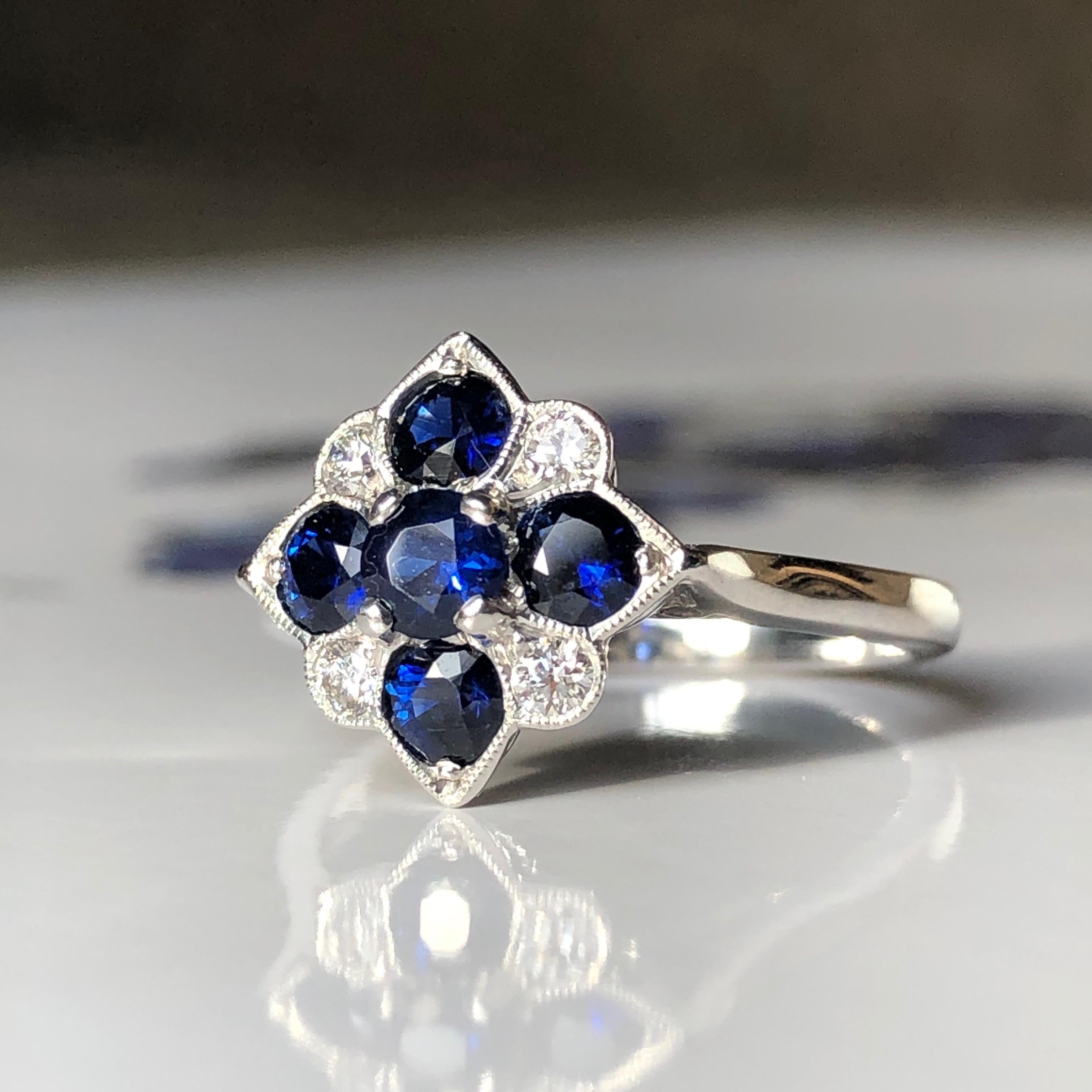 An Elegant Sapphire and Diamond Ring Art Deco Style Ring 

Set With 5 Deep Rich Blue Sapphires and four round brilliant cut diamonds

Excellent craftsmanship 

This ring is also available in Ruby and Diamond please see our shop 

Sapphire, chosen by