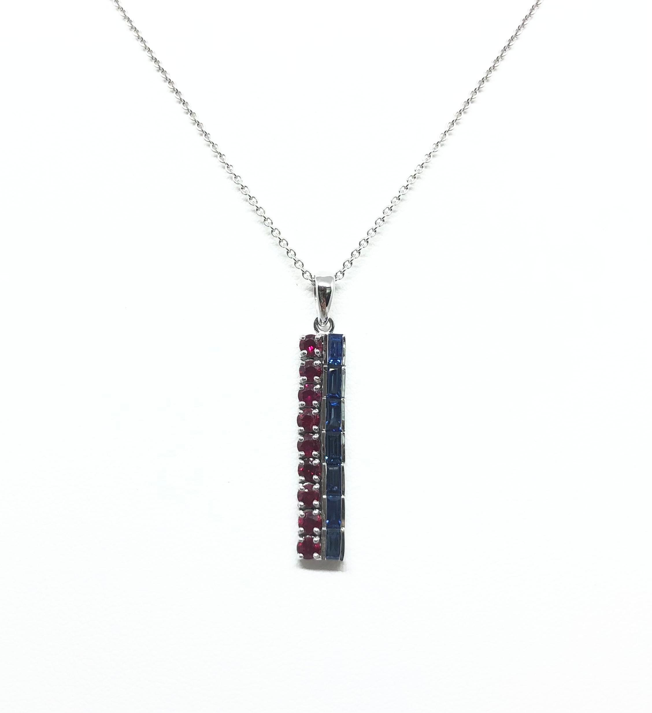 Blue Sapphire 1.03 carats and Ruby 0.90 carat Pendant set in 18 Karat White Gold Settings
(chain not included)

Width: 0.6 cm 
Length: 3.6 cm
Total Weight: 4.27 grams

