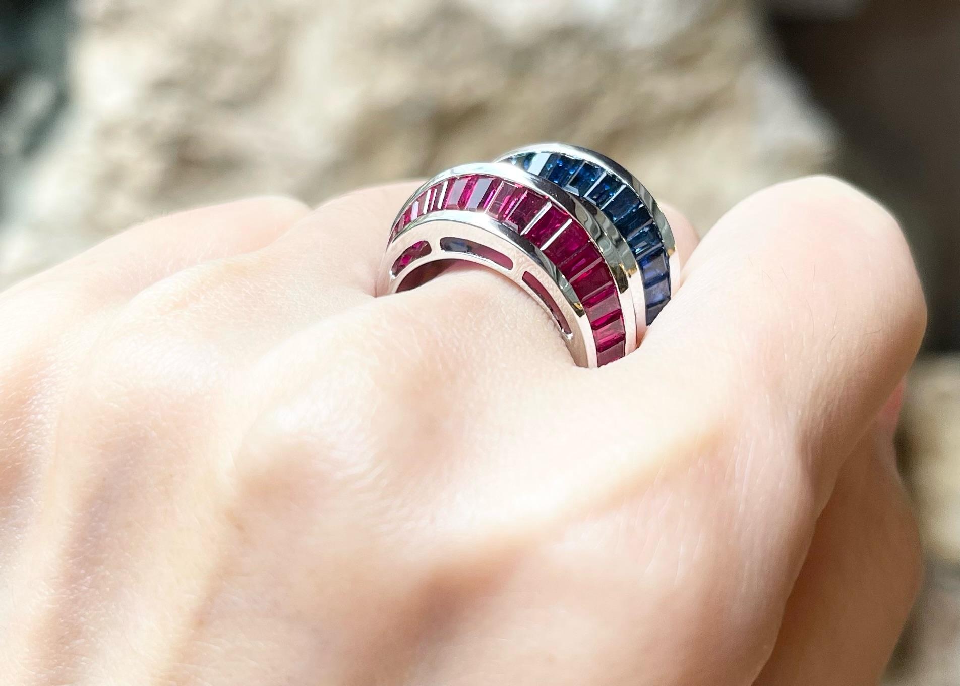 Contemporary Blue Sapphire and Ruby Ring set in 18K White Gold Settings For Sale