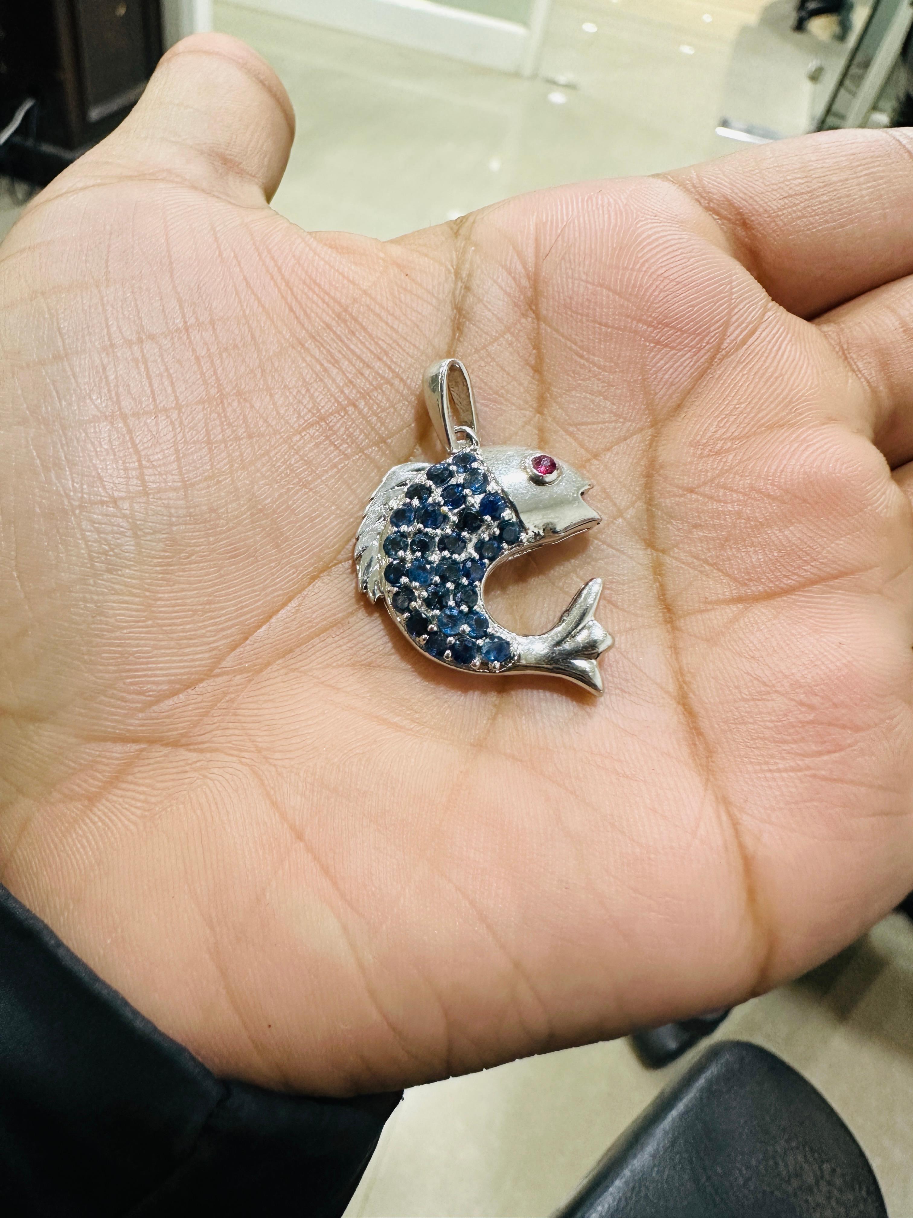 This Blue Sapphire and Ruby Studded Dolphin Pendant is meticulously crafted from the finest materials and adorned with stunning sapphire and ruby where sapphire helps in relieving stress, anxiety and depression and ruby enhances confidence,
