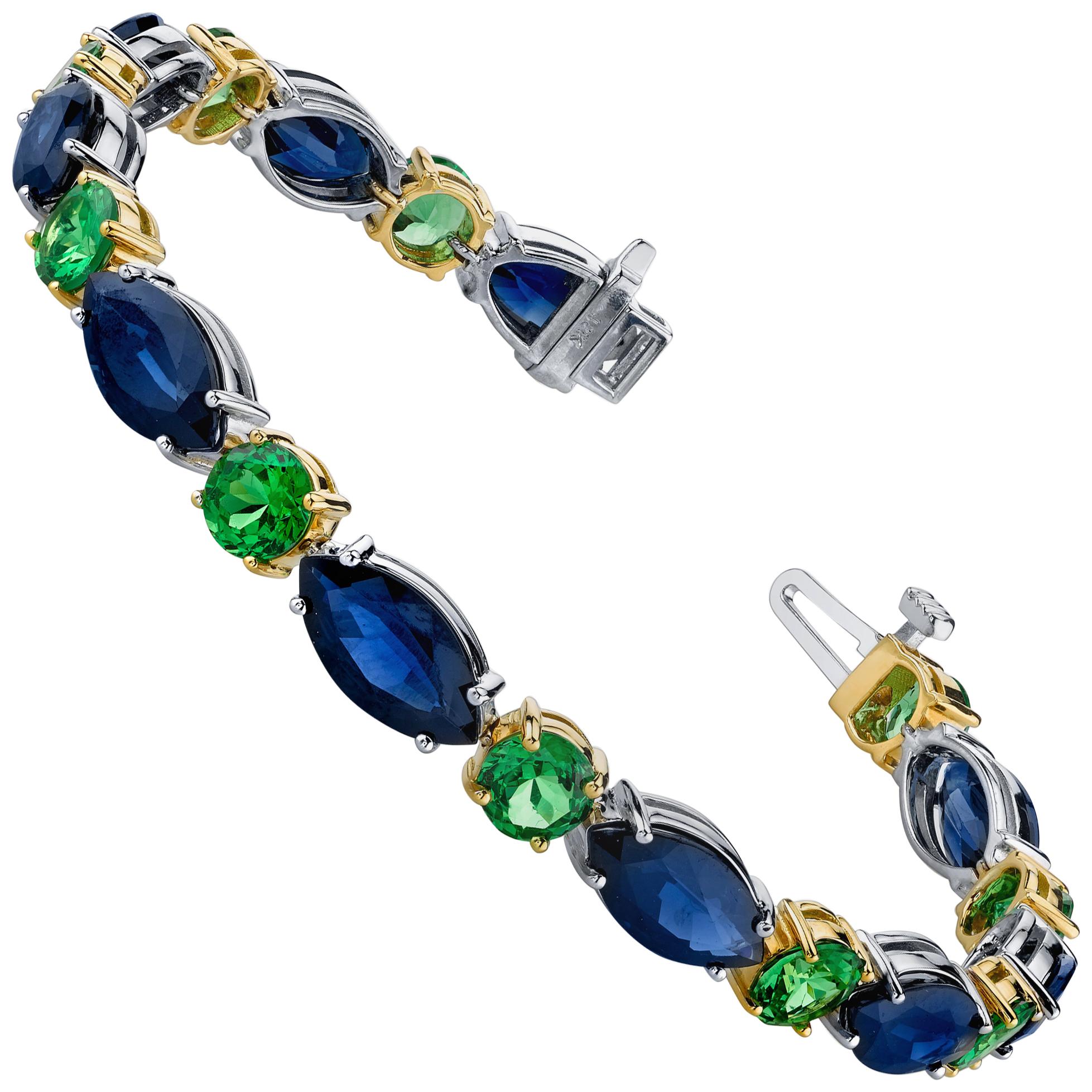 This stylish bracelet pairs royal blue sapphires with sparkling, grass-green tsavorite garnets in a modern take on the classic tennis bracelet. The sleek outlines of the marquise shaped sapphires create an elegant flow, with vivid green tsavorite