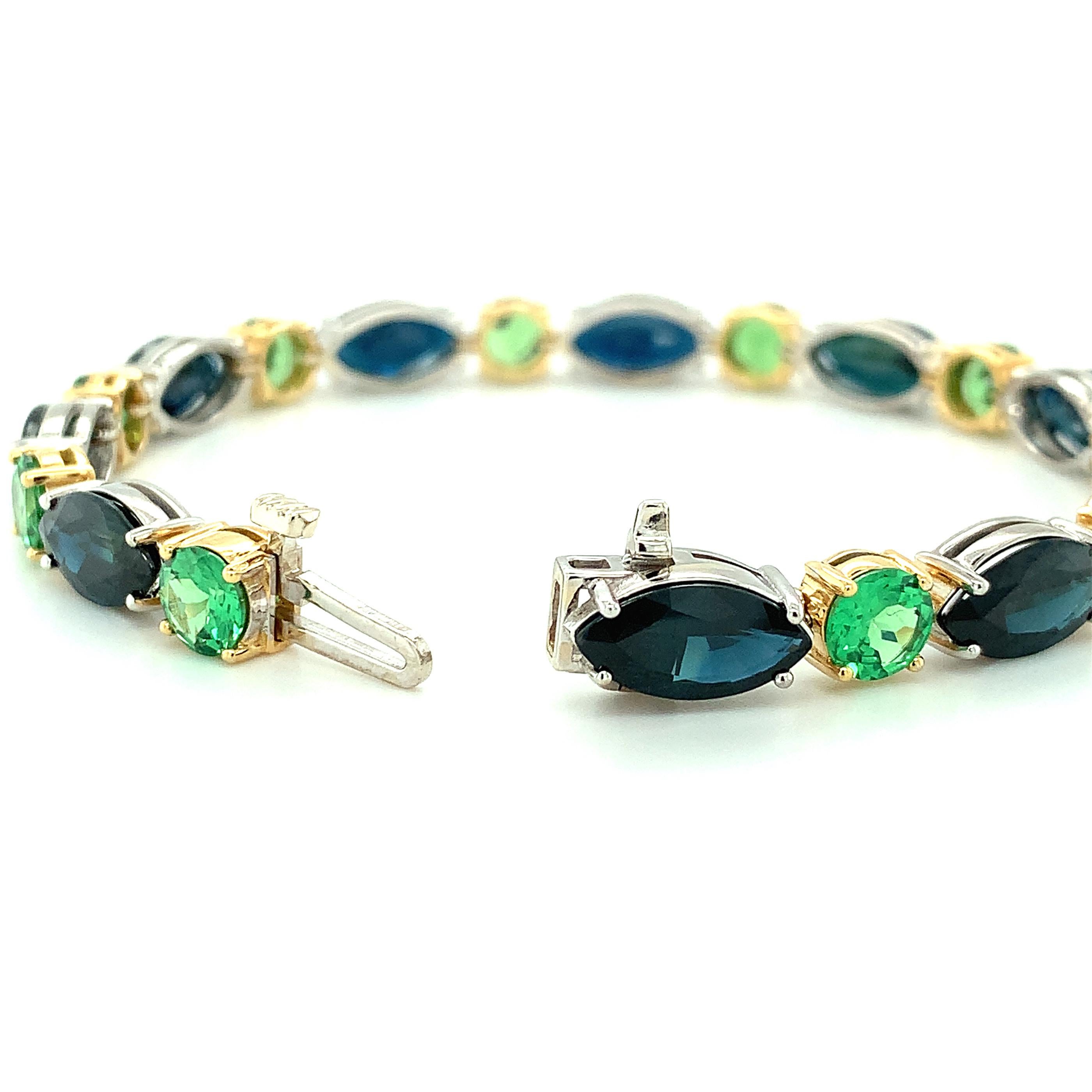 Artisan Blue Sapphire and Tsavorite Garnet Tennis Bracelet in White and Yellow Gold For Sale