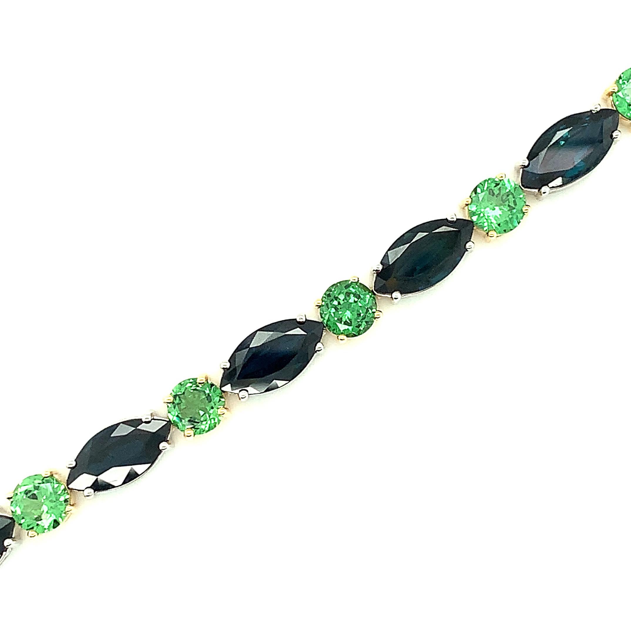 Marquise Cut Blue Sapphire and Tsavorite Garnet Tennis Bracelet in White and Yellow Gold For Sale