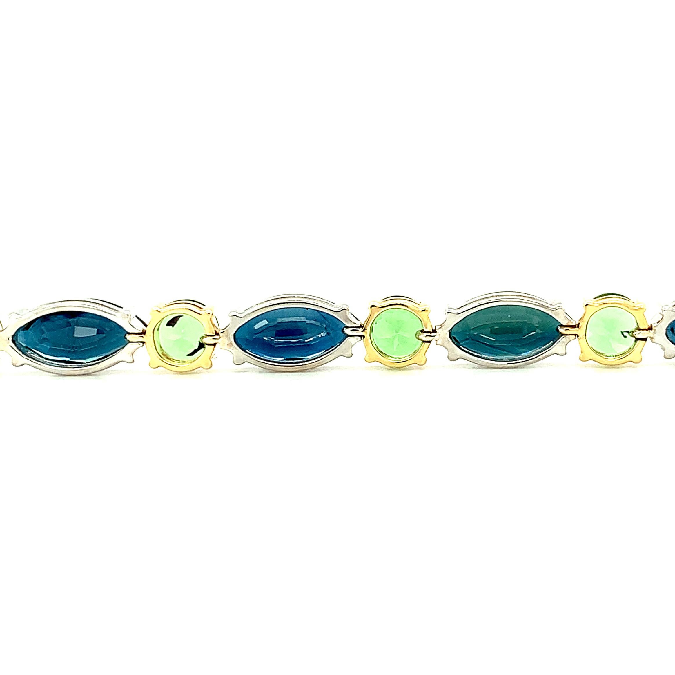 Women's Blue Sapphire and Tsavorite Garnet Tennis Bracelet in White and Yellow Gold For Sale