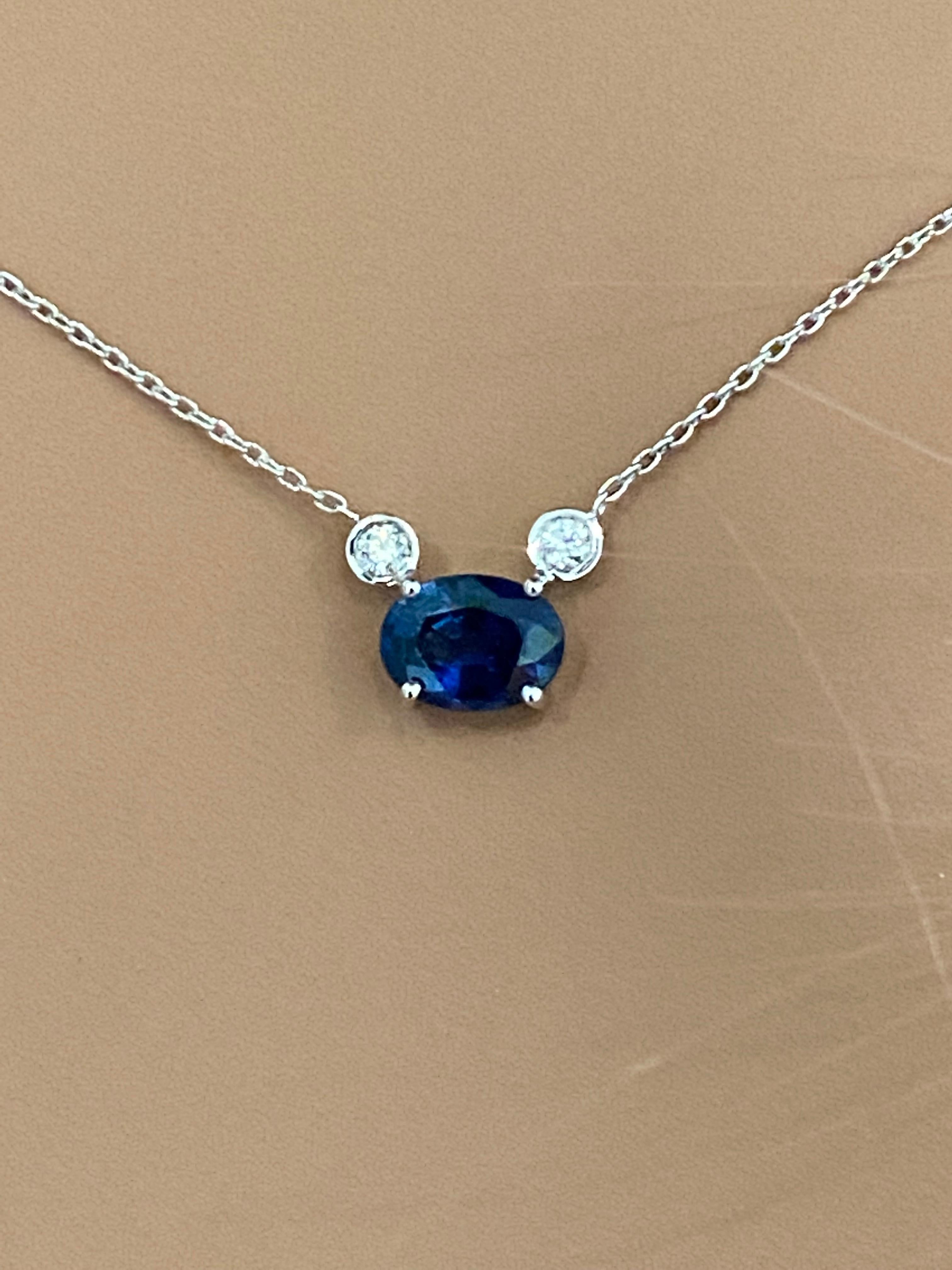 Oval Cut Blue Sapphire and Two Diamonds Drop Gold Pendant Necklace