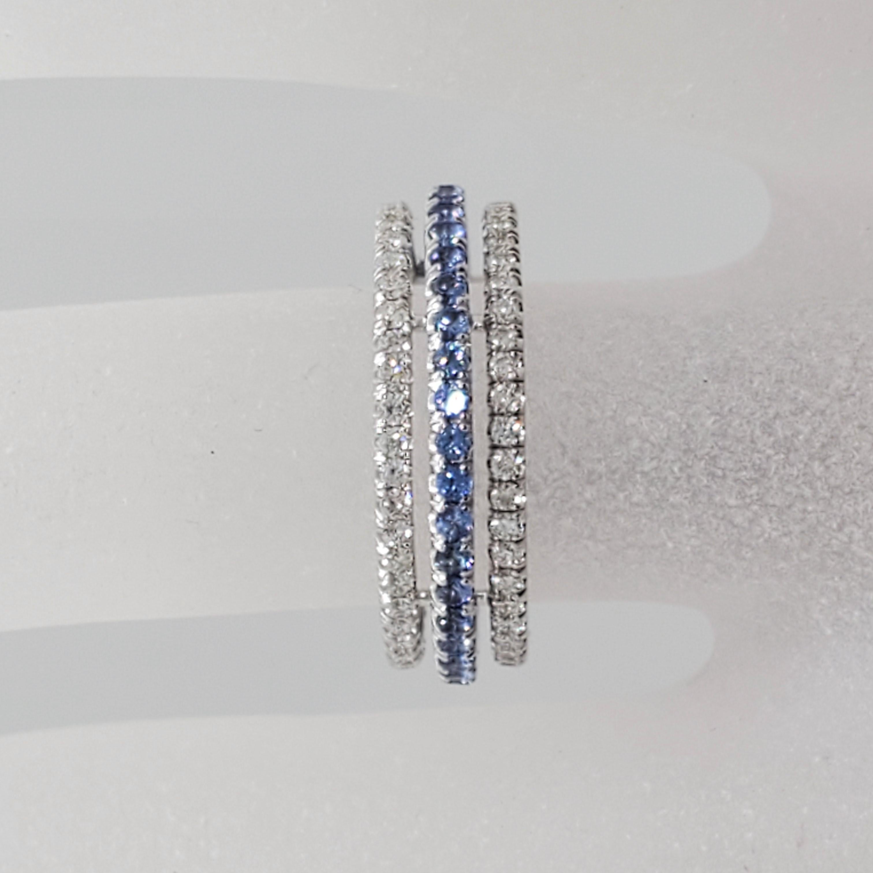 Beautiful blue sapphire and white diamond band featuring 0.69 cts of blue sapphire rounds and 0.71 cts of white diamond rounds.  Handmade in 14k white gold in a size 6.  Great for stacking!  Matching pink sapphire and diamond band on another listing.