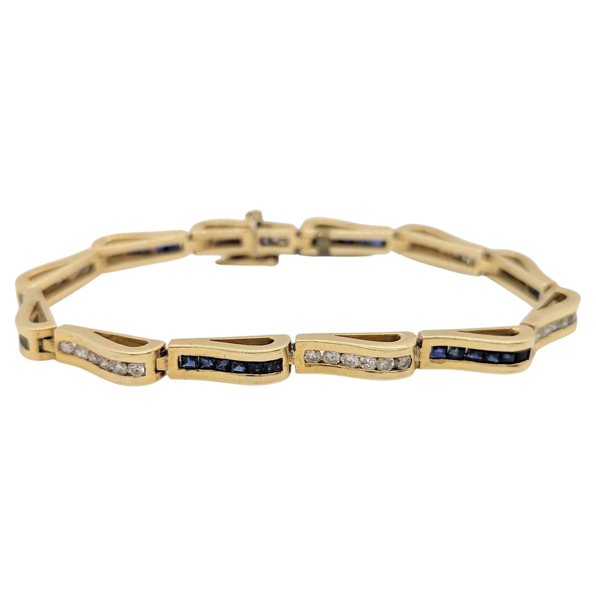 Armband aus 14 Karat Gelbgold mit blauem Saphir und weißen Diamanten