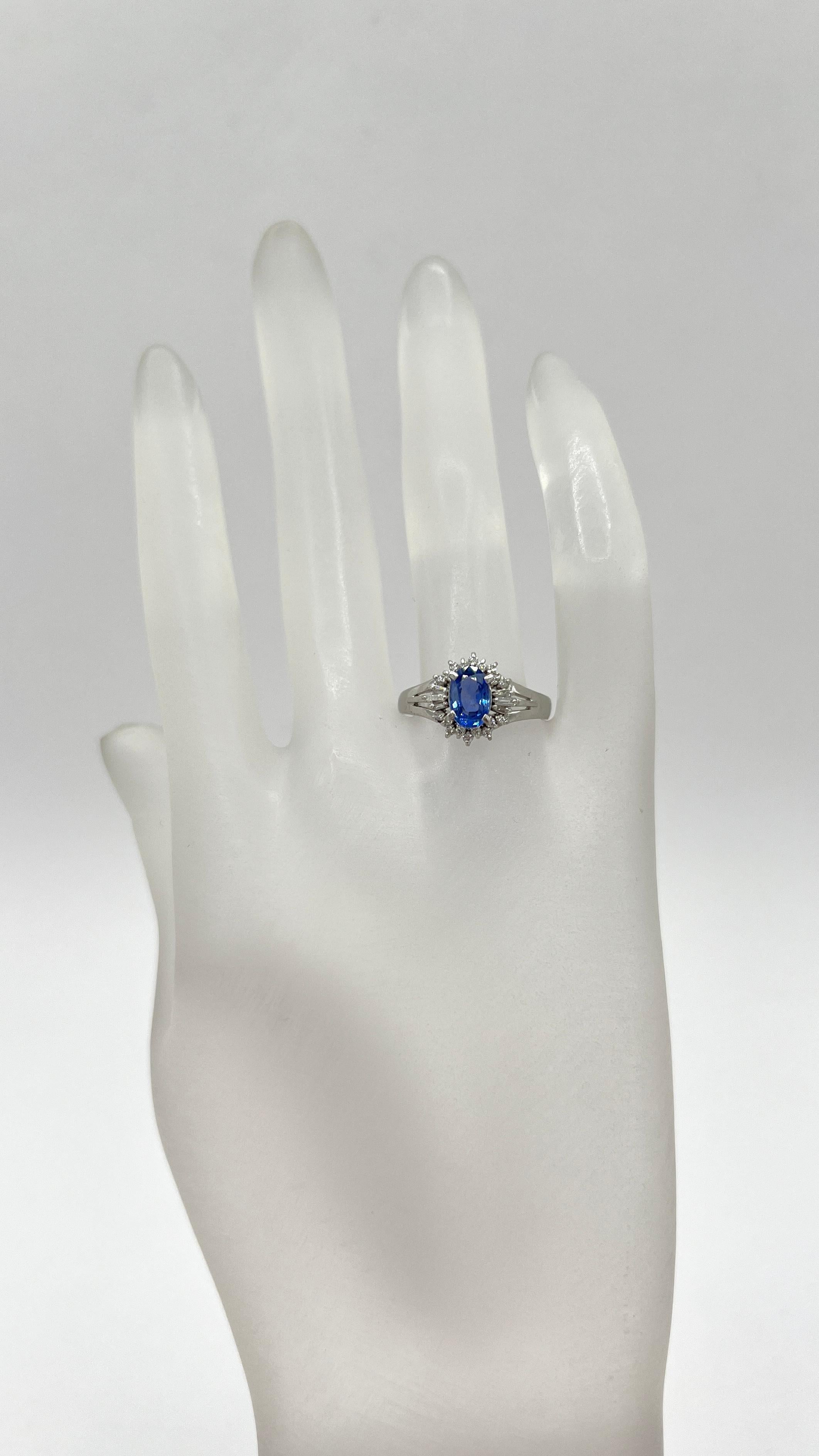 Beautiful 1.80 ct. blue sapphire oval with 0.23 ct. good quality white diamond rounds and baguettes.  Handmade in platinum.  Ring size 7.

