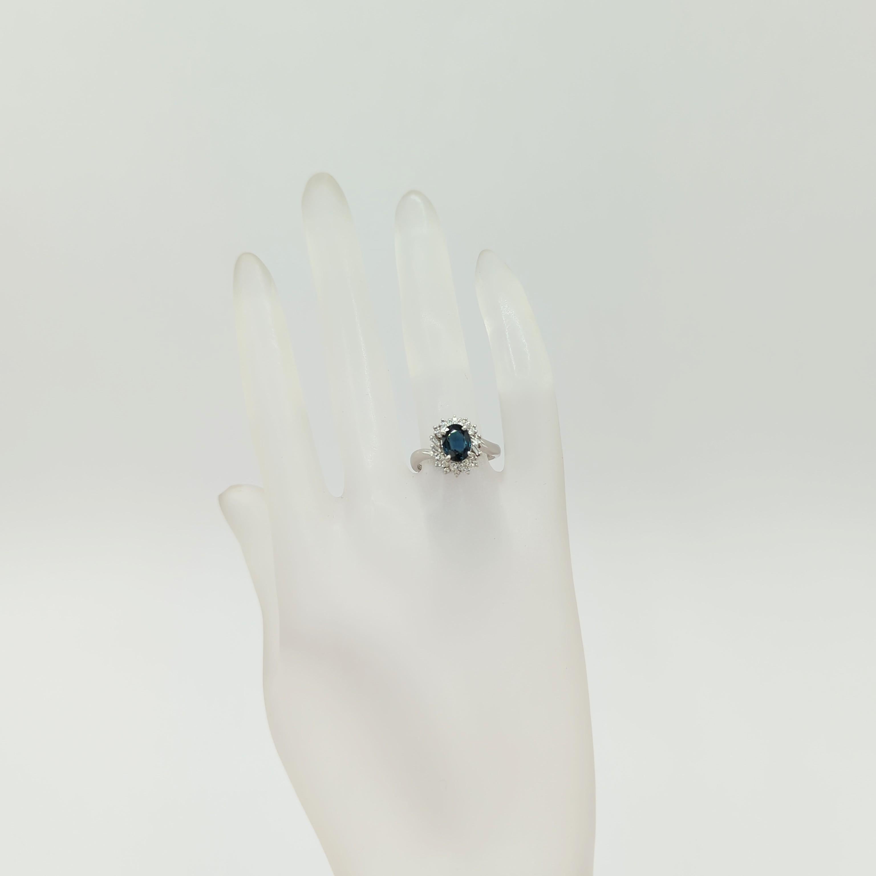 Oval Cut Blue Sapphire and White Diamond Cluster Ring in Platinum
