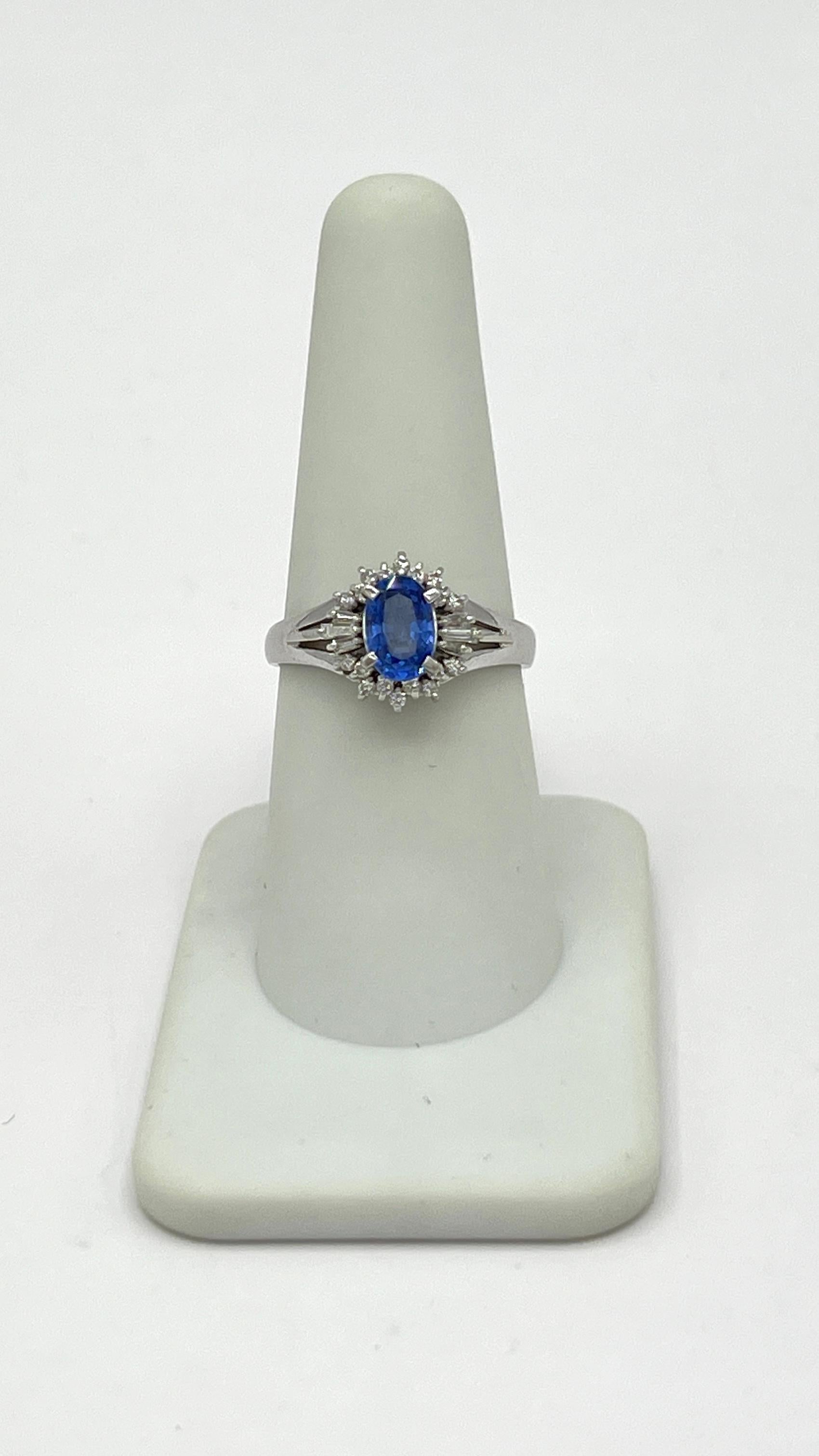 Oval Cut Blue Sapphire and White Diamond Cluster Ring in Platinum For Sale