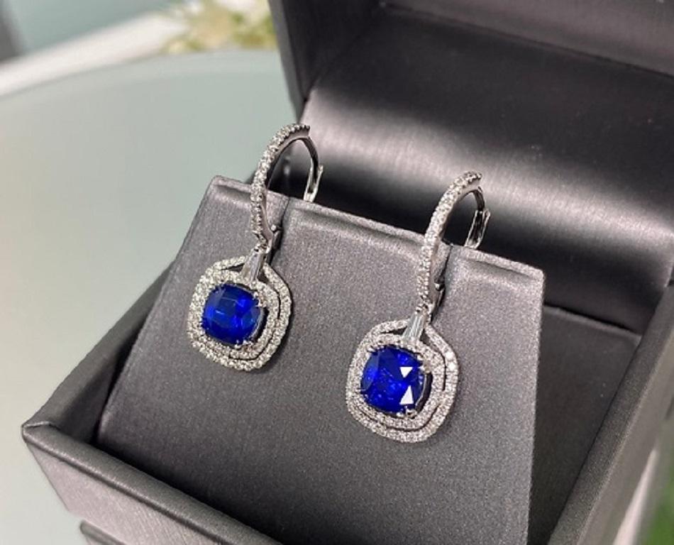 Blue sapphire and white diamond cushion-cut dangle earrings in 18K white gold

Product Features:
Sapphire Weight: 2.62 Cts
Sapphire Measurements: 6x6 mm
Diamond Weight: 0.74 Cts
18K White Gold
Hardness: 9
Birthstone: September