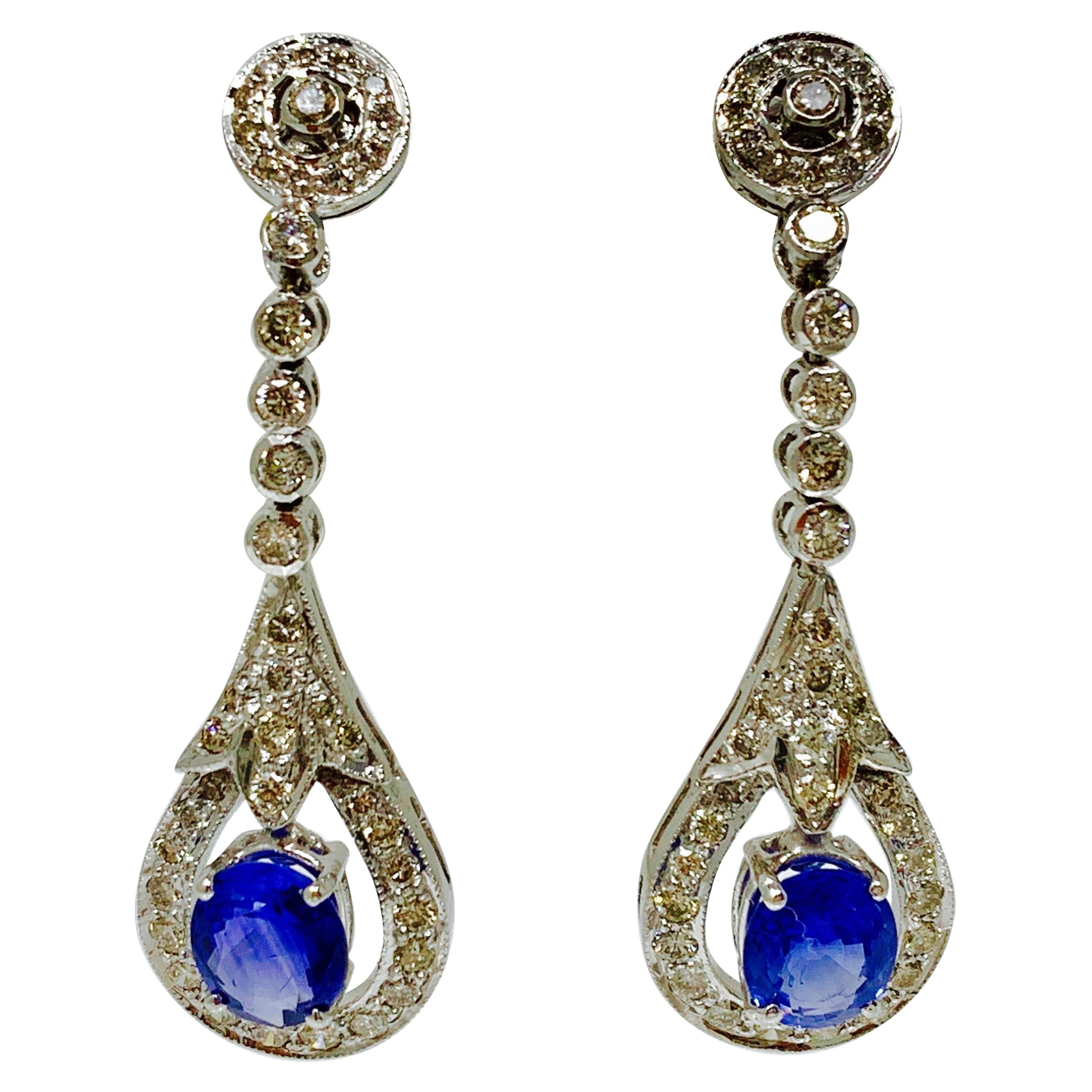 Blue Sapphire and White Diamond Dangle Earrings in 14 Karat Gold For Sale