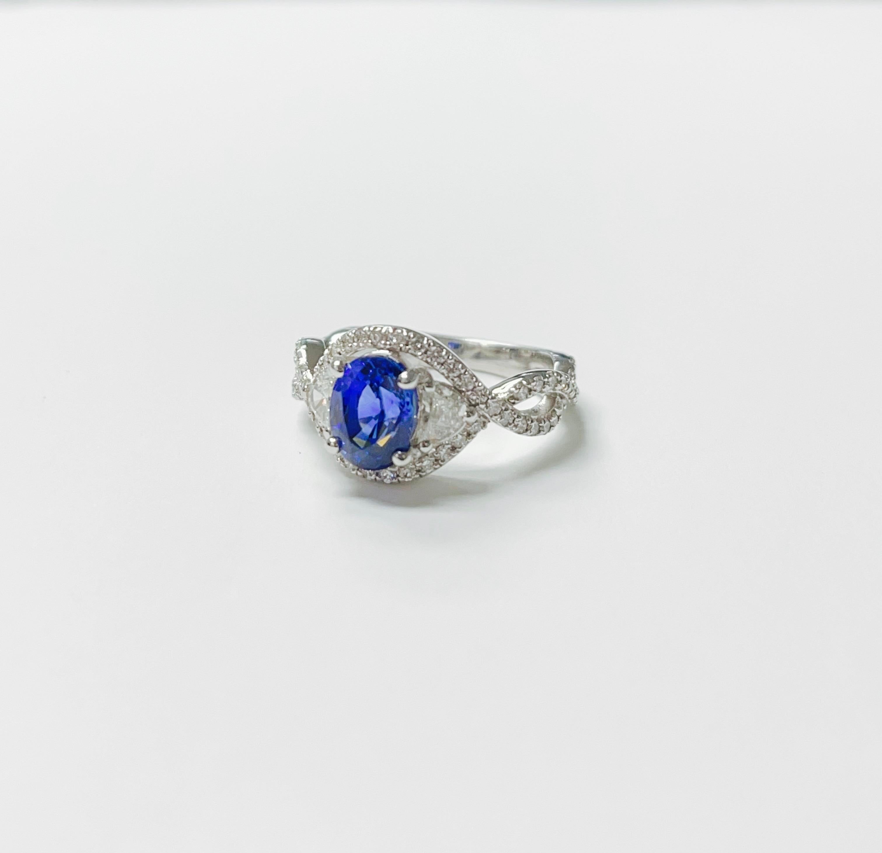 Blue Sapphire and diamond engagement ring handcrafted in 18k white gold. 
Blue sapphire : 2.06 carat 
Diamond weight : 0.81 carat ( GH color and VS clarity ) 
Metal : 18 K white gold 
