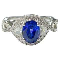 Blue Sapphire and White Diamond Engagement Ring in 18k White Gold