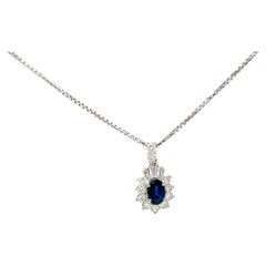 Blue Sapphire and White Diamond Pendant Necklace in Platinum