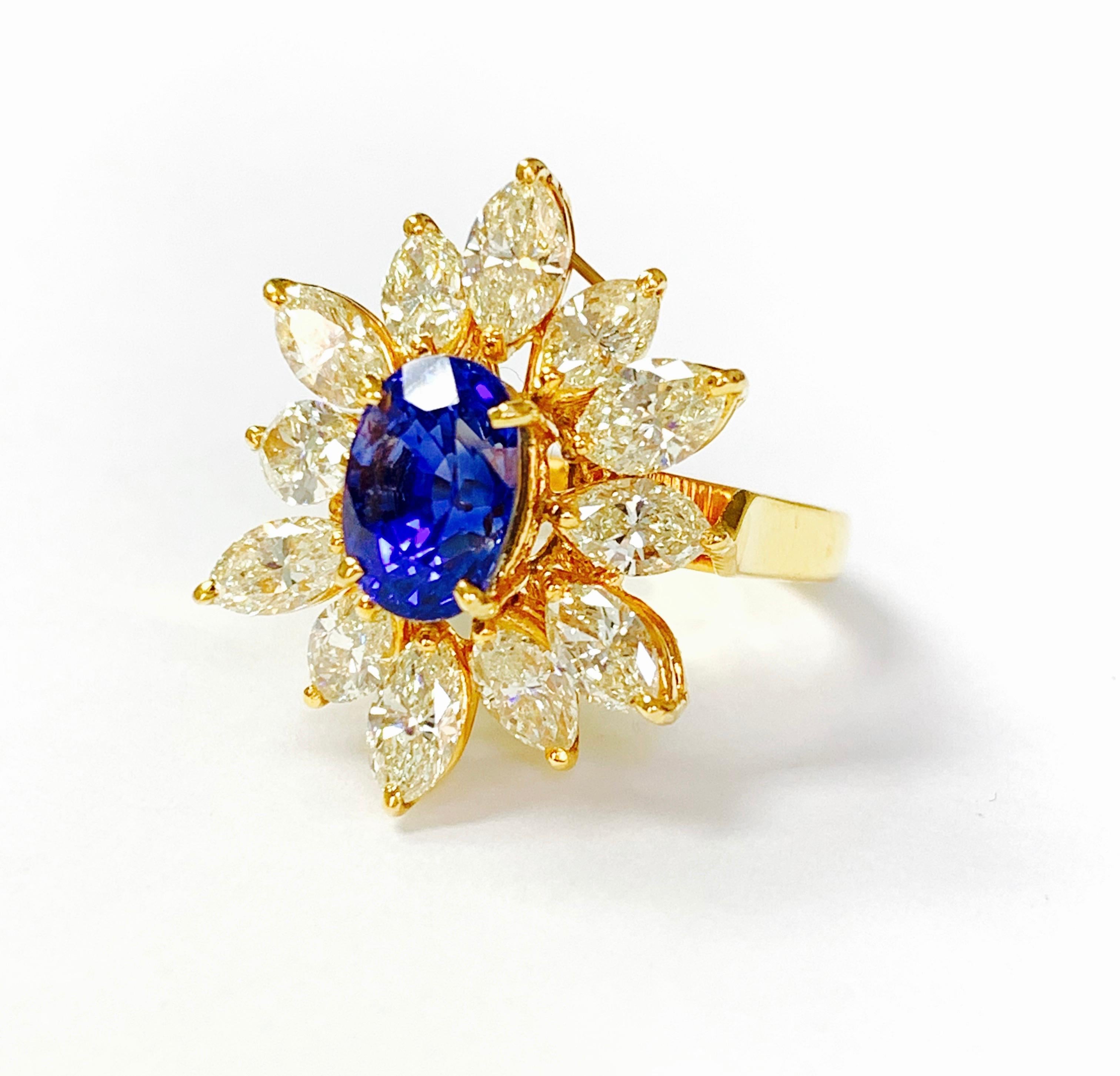 Moguldiam Inc's oval blue sapphire and yellow marquise diamond ring in 18 k yellow gold is beautifully handmade. 
The details are as follows : 
Blue sapphire weight: 3.18 carat 
Yellow diamond weight: 3.38 carat 
Gold weight : 6.69 grams 
Ring size