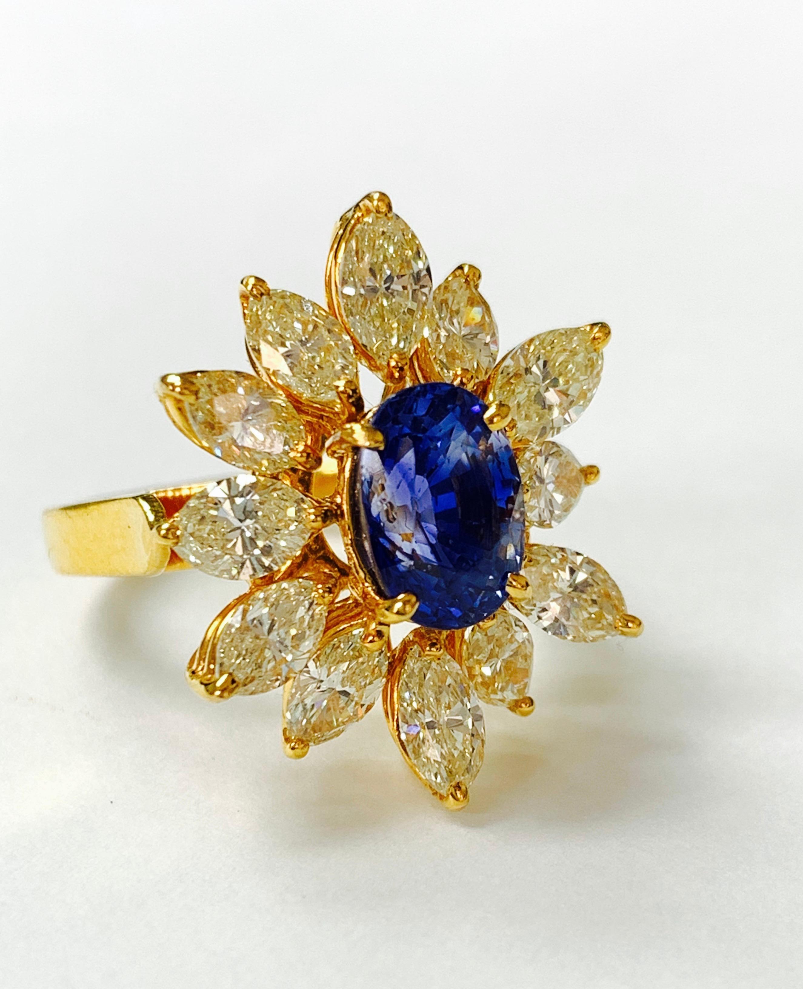 Contemporary Blue Sapphire and Yellow Diamond Ring in 18 Karat Yellow Gold For Sale