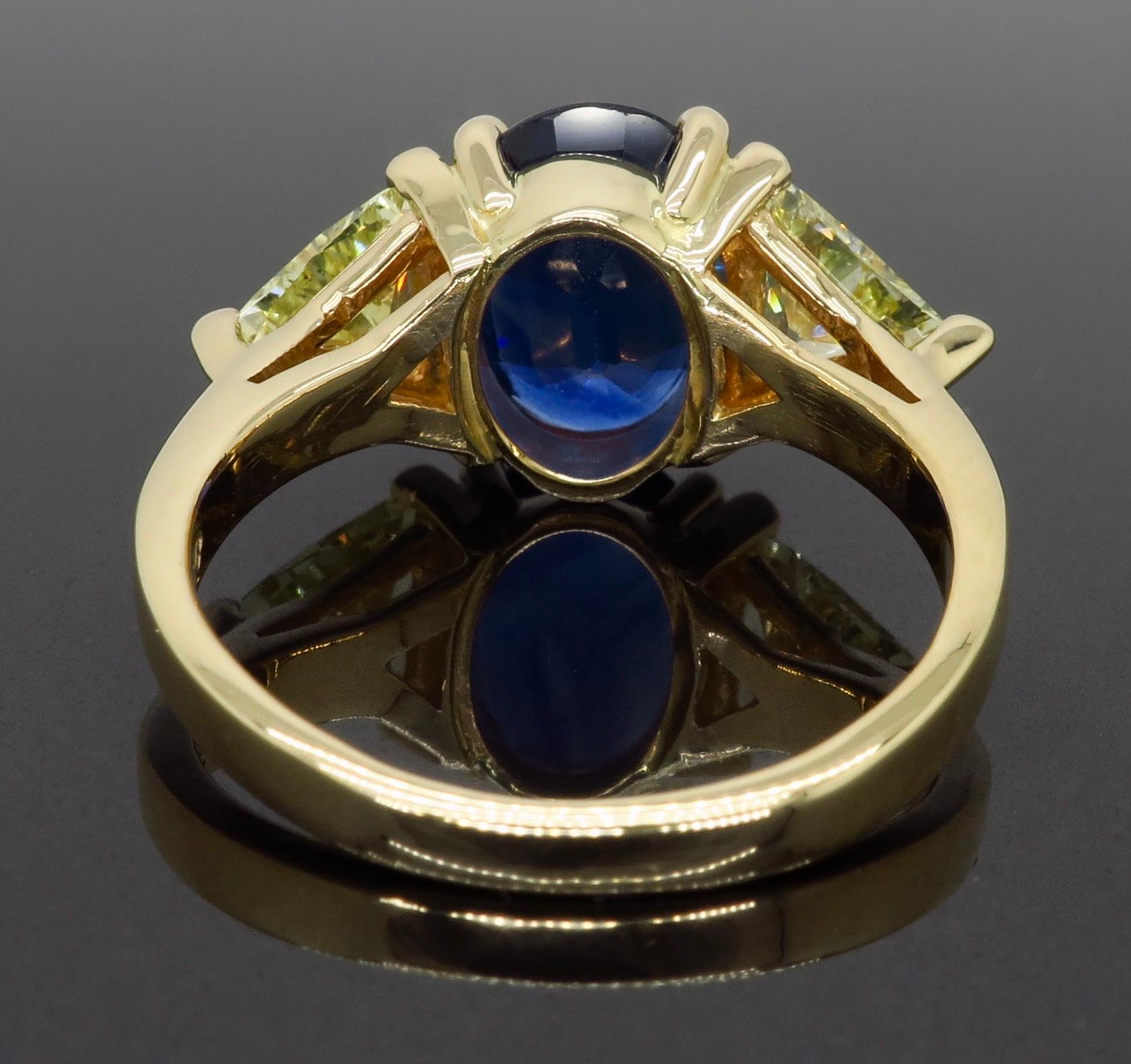 Oval Cut Blue Sapphire and Yellow Diamond Three-Stone Ring