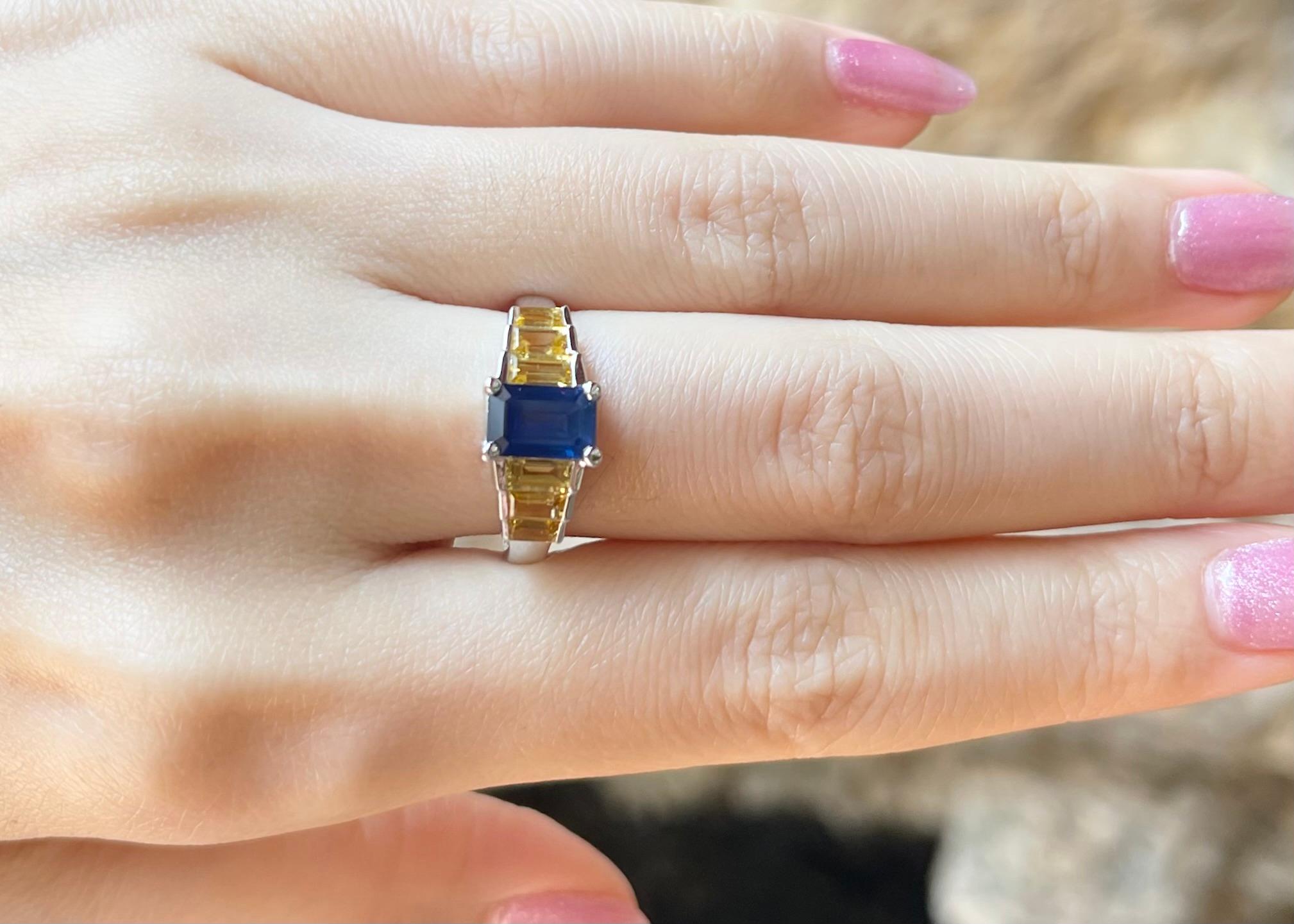 Contemporary Blue Sapphire and Yellow Sapphire Ring set in 18K White Gold Settings For Sale