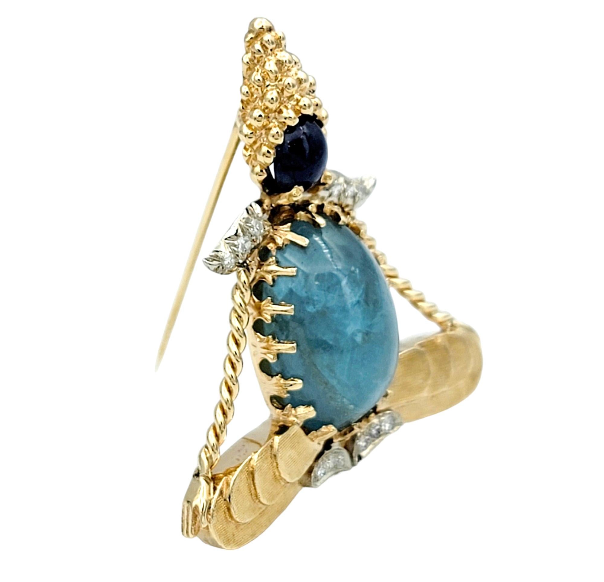 Contemporary Blue Sapphire, Aquamarine and Diamond Yogi Brooch Set in 14 Karat Yellow Gold For Sale