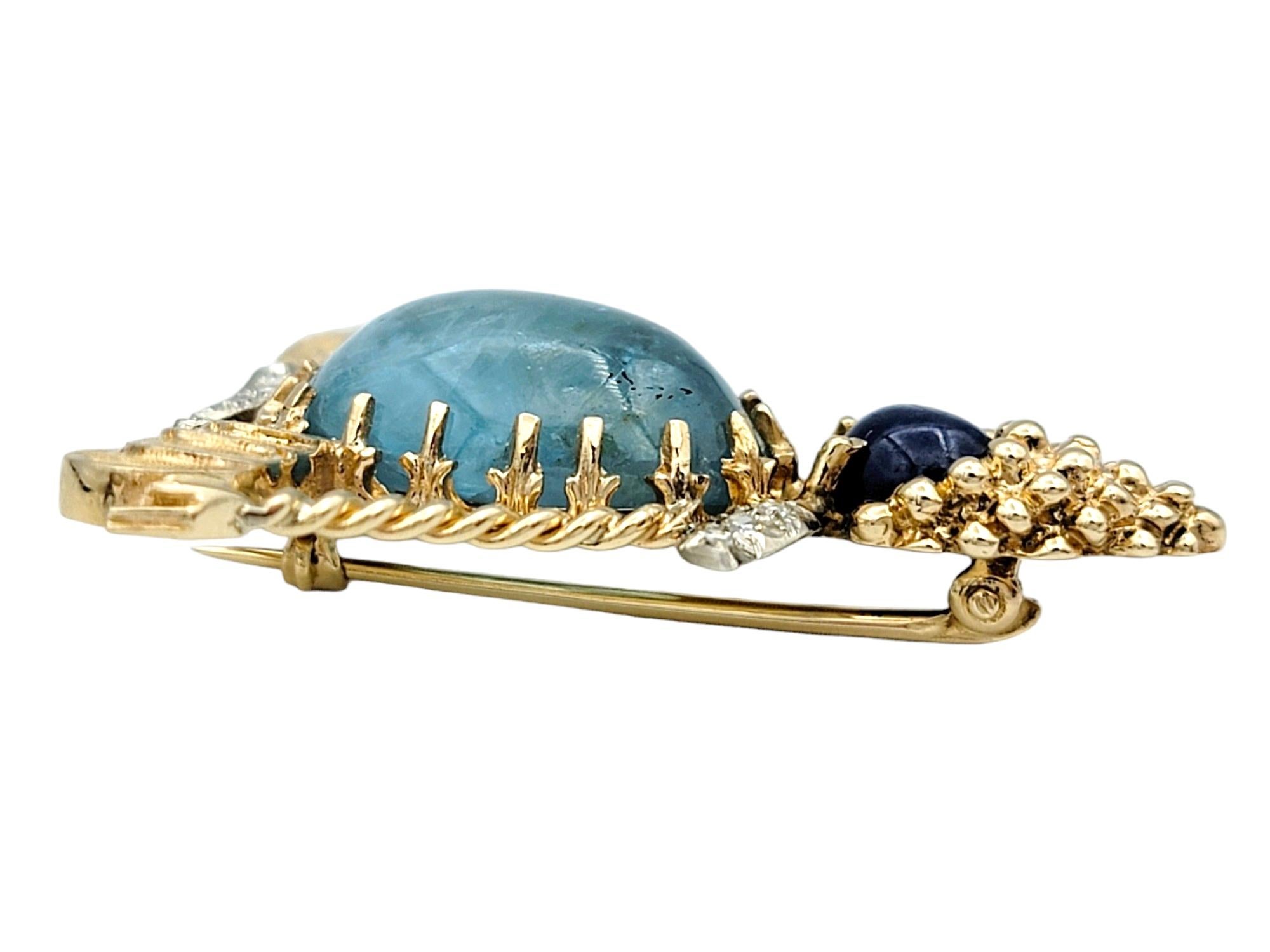 Cabochon Blue Sapphire, Aquamarine and Diamond Yogi Brooch Set in 14 Karat Yellow Gold For Sale