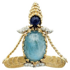 Yogi-Brosche mit blauem Saphir, Aquamarin und Diamant aus 14 Karat Gelbgold