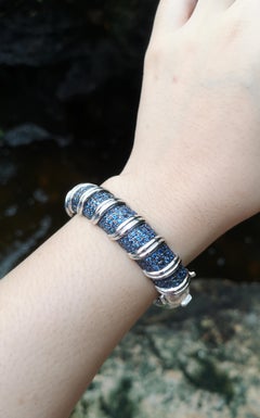 Blue Sapphire Bangle set in Silver Settings