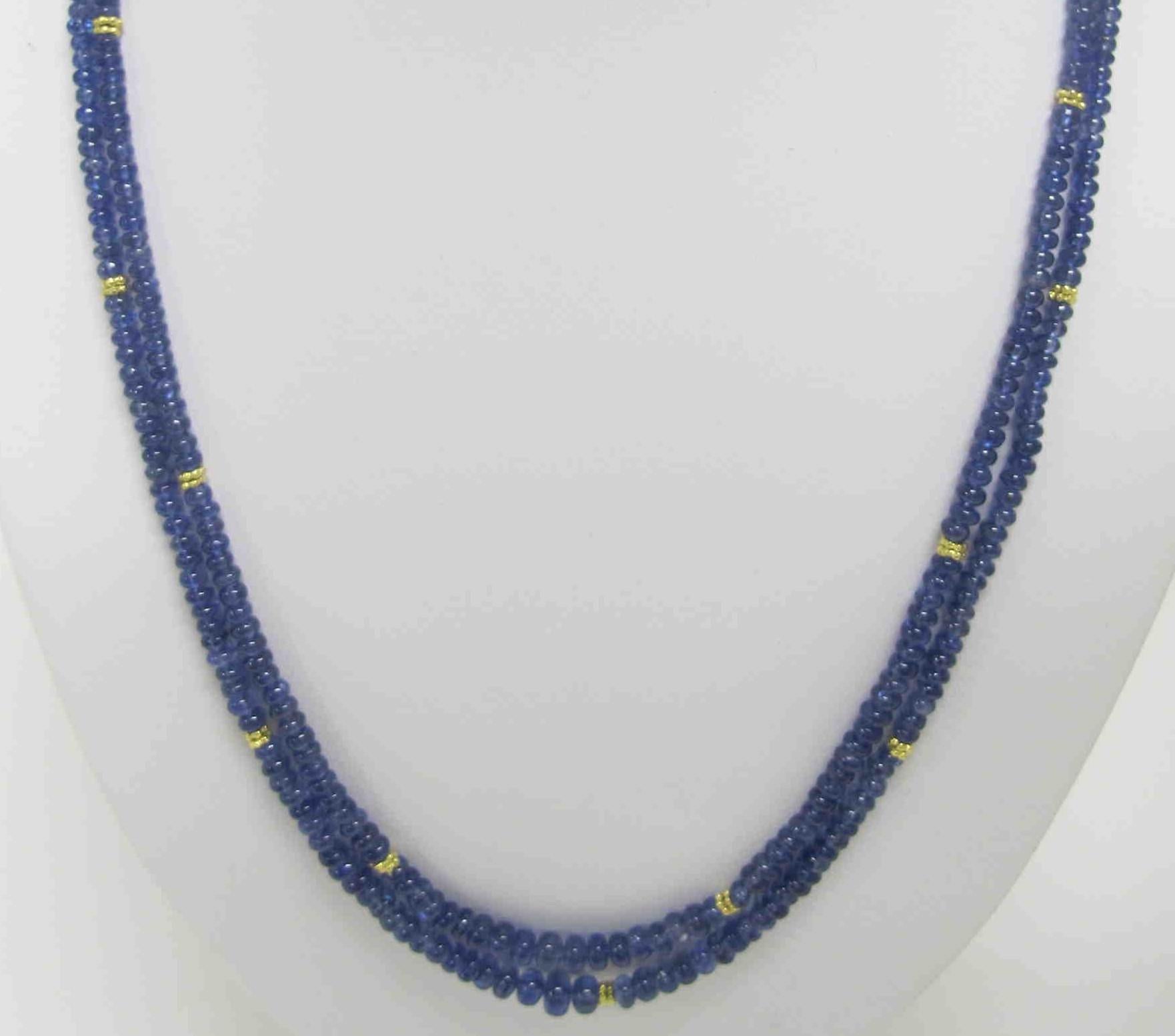 This beautiful double strand of natural blue sapphire beads features approximately 100 carats of graduated beads ranging in size from 1.25 to 5.00mm. The strands measure 18 and 18.5 inches in length, and the 18k yellow gold clasp has a 2-inch