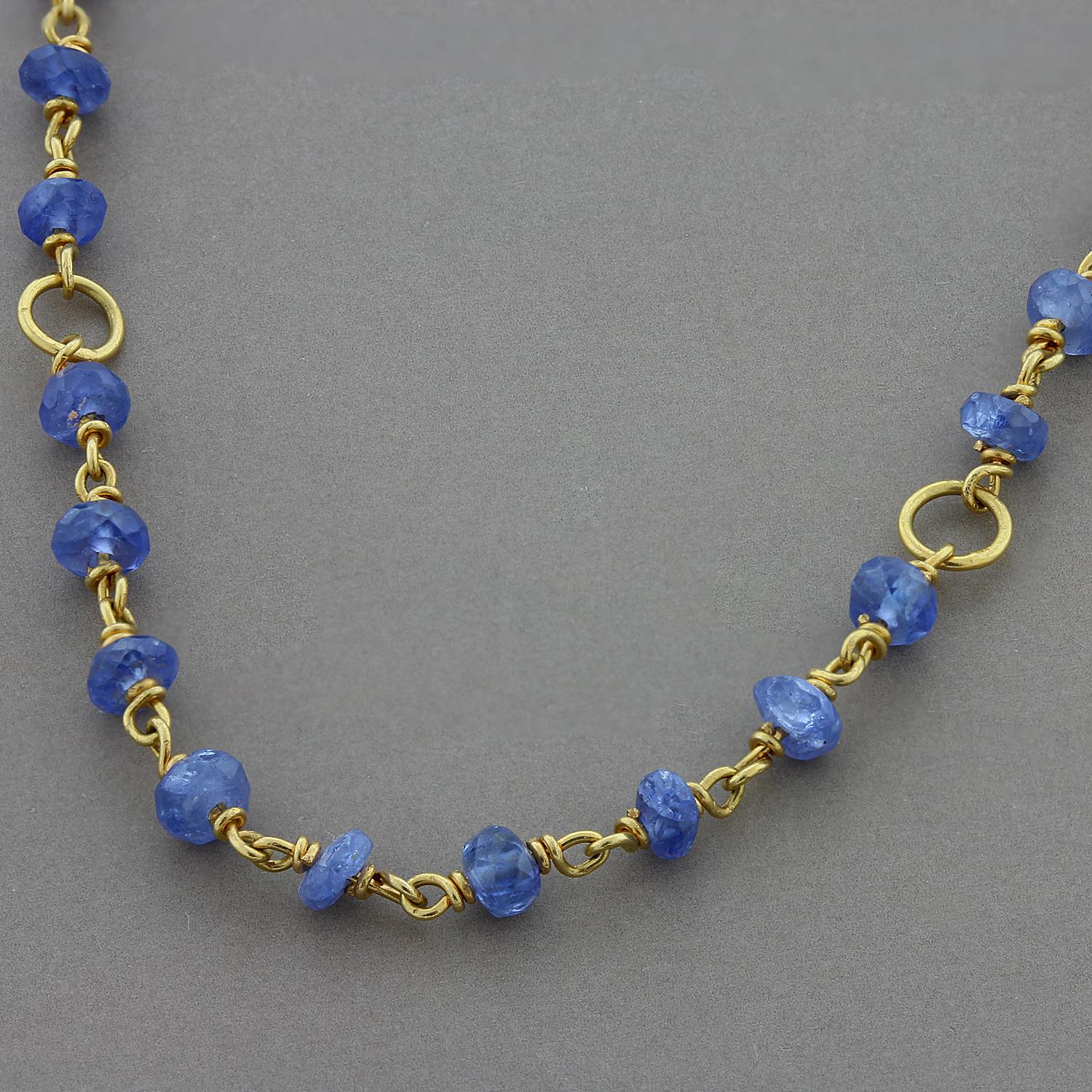 A delicate and sweet everyday necklace featuring blue sapphire beads with six gold halos. Set in 14K yellow gold.

Necklace Length: 15.5 inches
