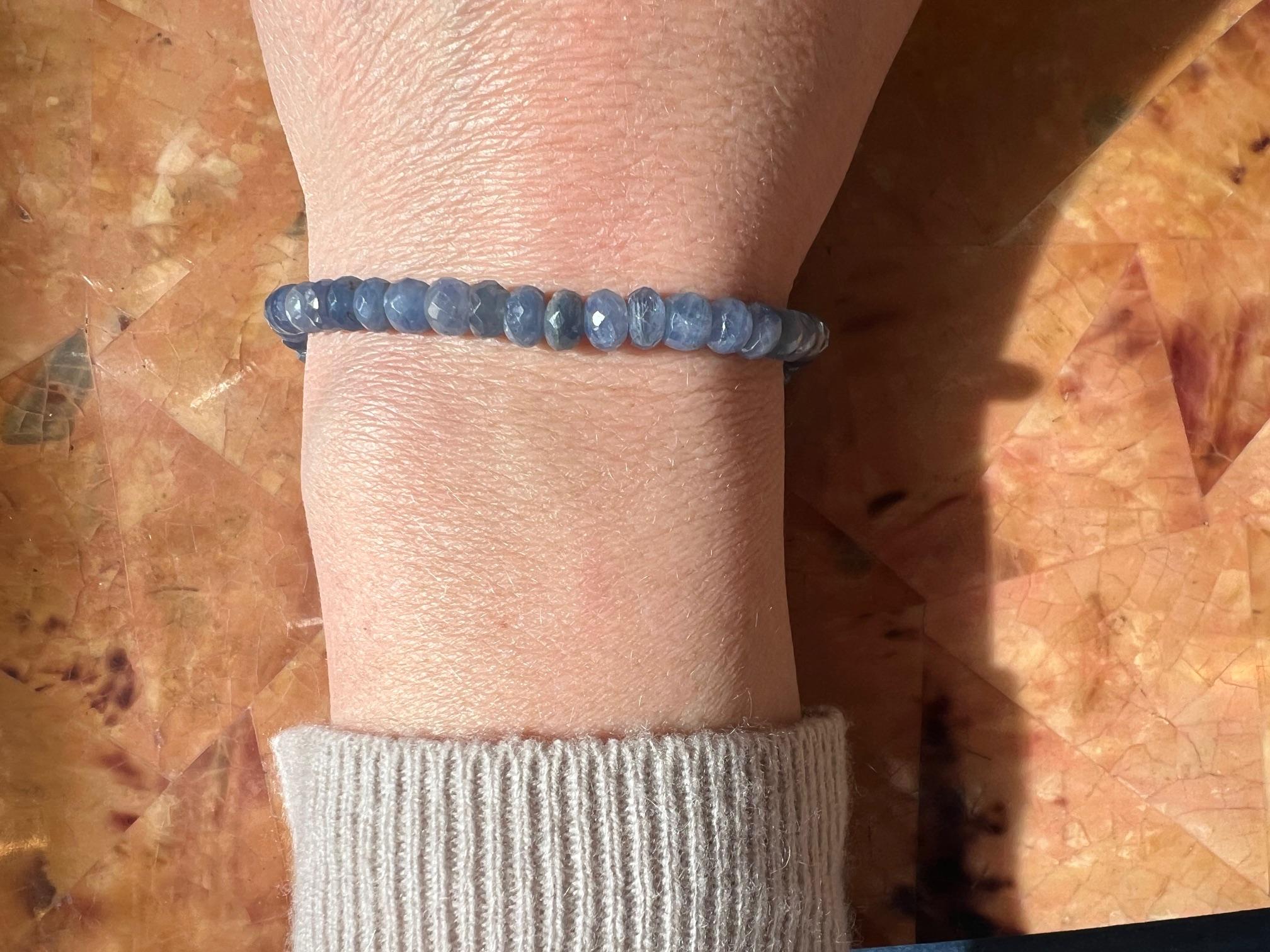 This elegant light blue sapphire bead bracelet radiates sophistication with its delicate yet vibrant hues. Measuring 8.25 inches, it features smooth, faceted sapphire beads that catch the light beautifully. At each end, sterling silver rondelles add