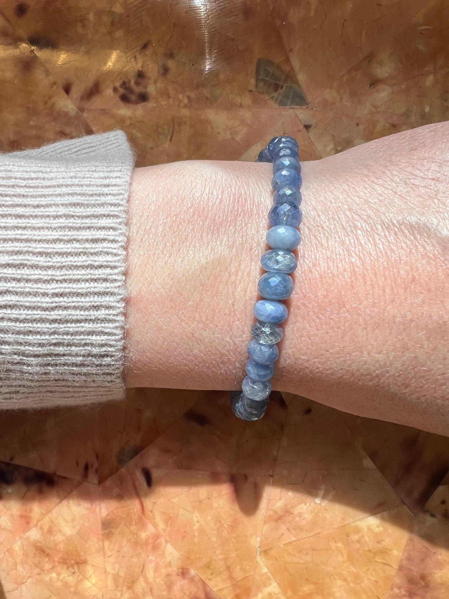 This exquisite light blue sapphire bead bracelet features a graceful gradient design, with the largest beads at the center gradually tapering to smaller ones at the ends for an elegant, balanced look. The natural sapphire beads showcase a soft,