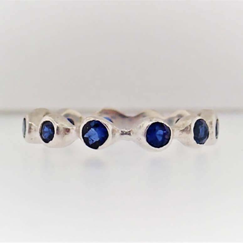This original Five Star Jewelry sapphire bezel band is a one of a kind design with genuine blue sapphire gemstones set in handmade bezel setting. The band has a unique, organic design that looks amazing paired with any jewelry! Pair this with your