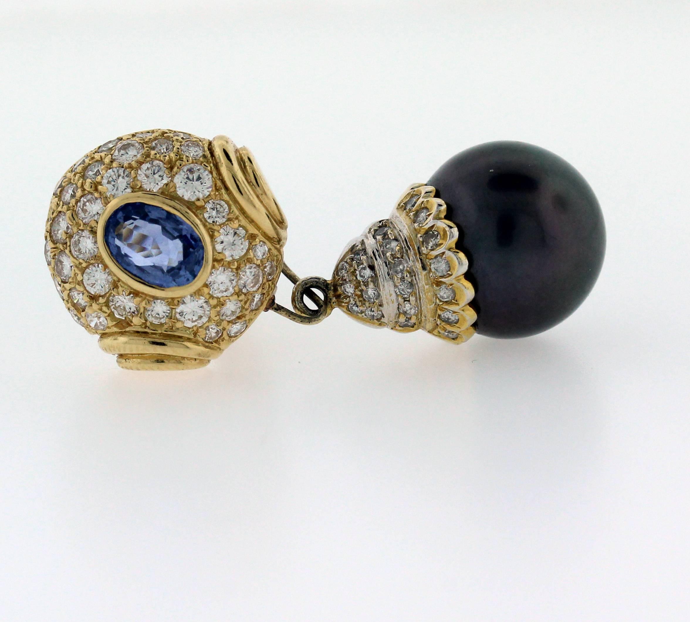 18K Gold Earrings with Black Pearls, Blue Sapphires and Diamonds

Gorgeous matching pair of black pearls

Apprx. 2.00ct. Blue Sapphires 

3.00ct. apprx. Diamonds

Earrings are 1.5 inch Length

Post-Omega Back

Estate