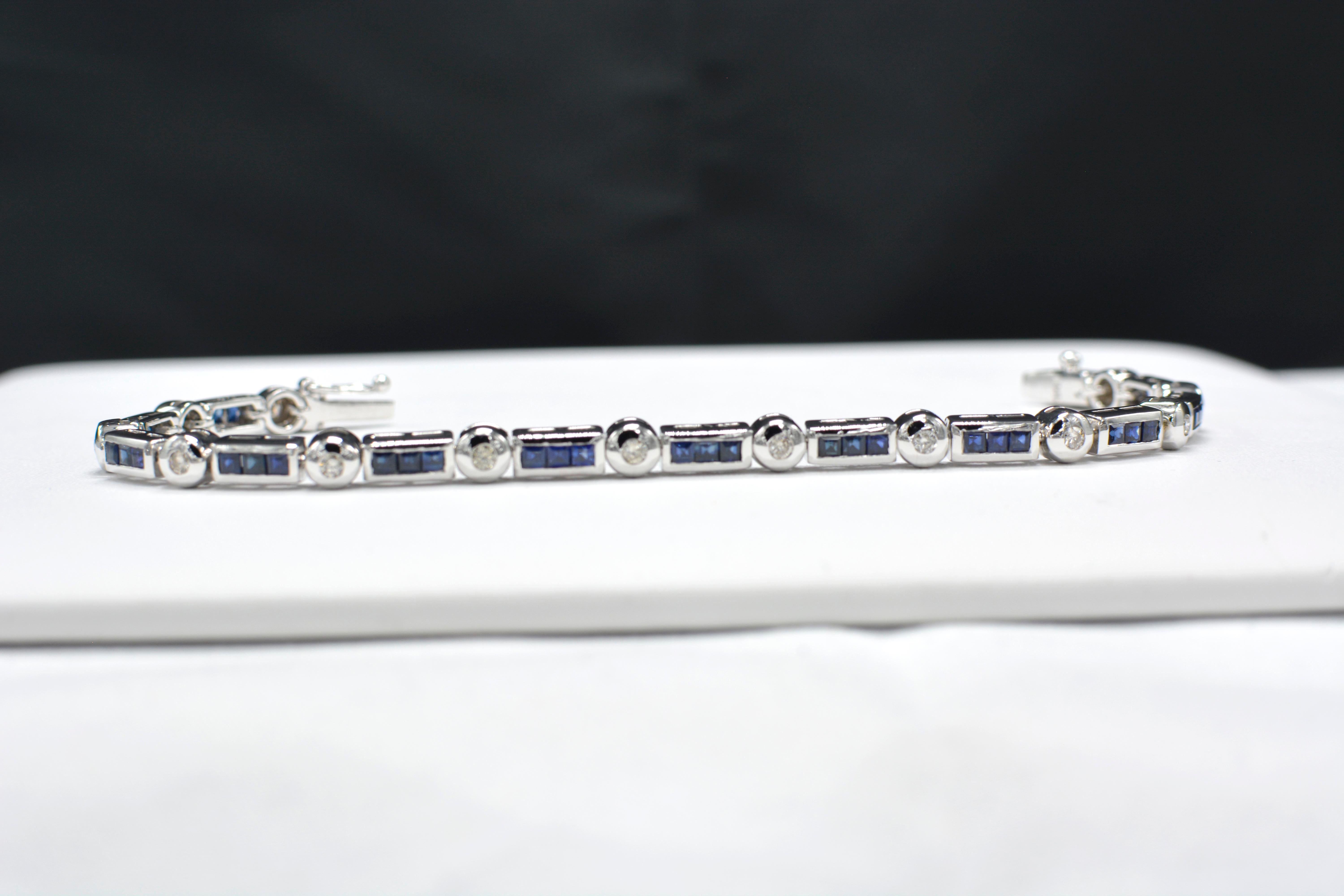 Blue sapphire Bracelet AAA Quality Sapphires princess-cut Total of 3.40 carat.
with round Diamonds total of 0.50 carat  H I-SI.
14K White Gold 20.0 Grams.
Lenght 7' Inch.
Bracelet width is approx 4 mm
